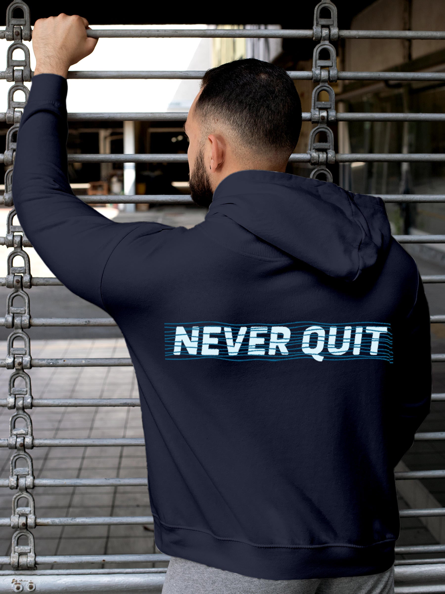 Model wearing Men's Navy Blue Hoodie Sweatshirt with 'Never Quit' design, offering effortless style and premium comfort