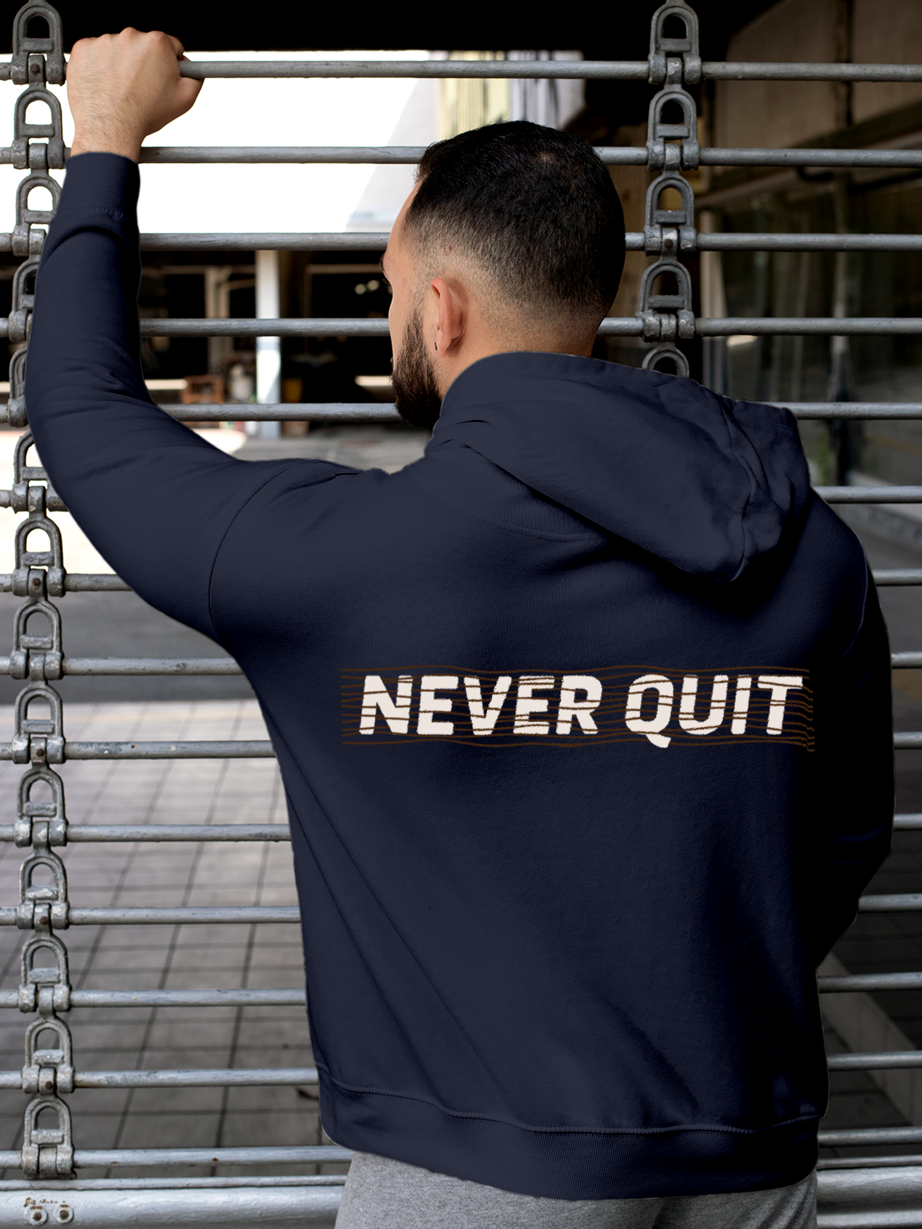 Fighterhero Hoodie Collection: Model wearing Men's Navy Blue Hoodie Sweatshirt with 'Never Quit' design