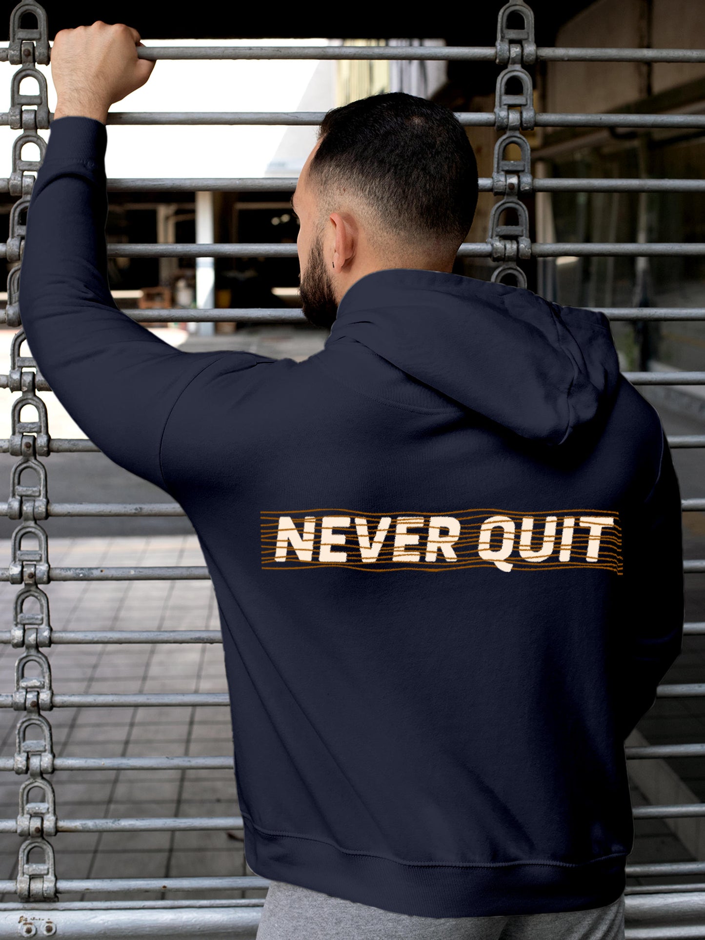 Model wearing Men's Navy Blue Hoodie Sweatshirt with 'Never Quit' design, offering effortless style and premium comfort
