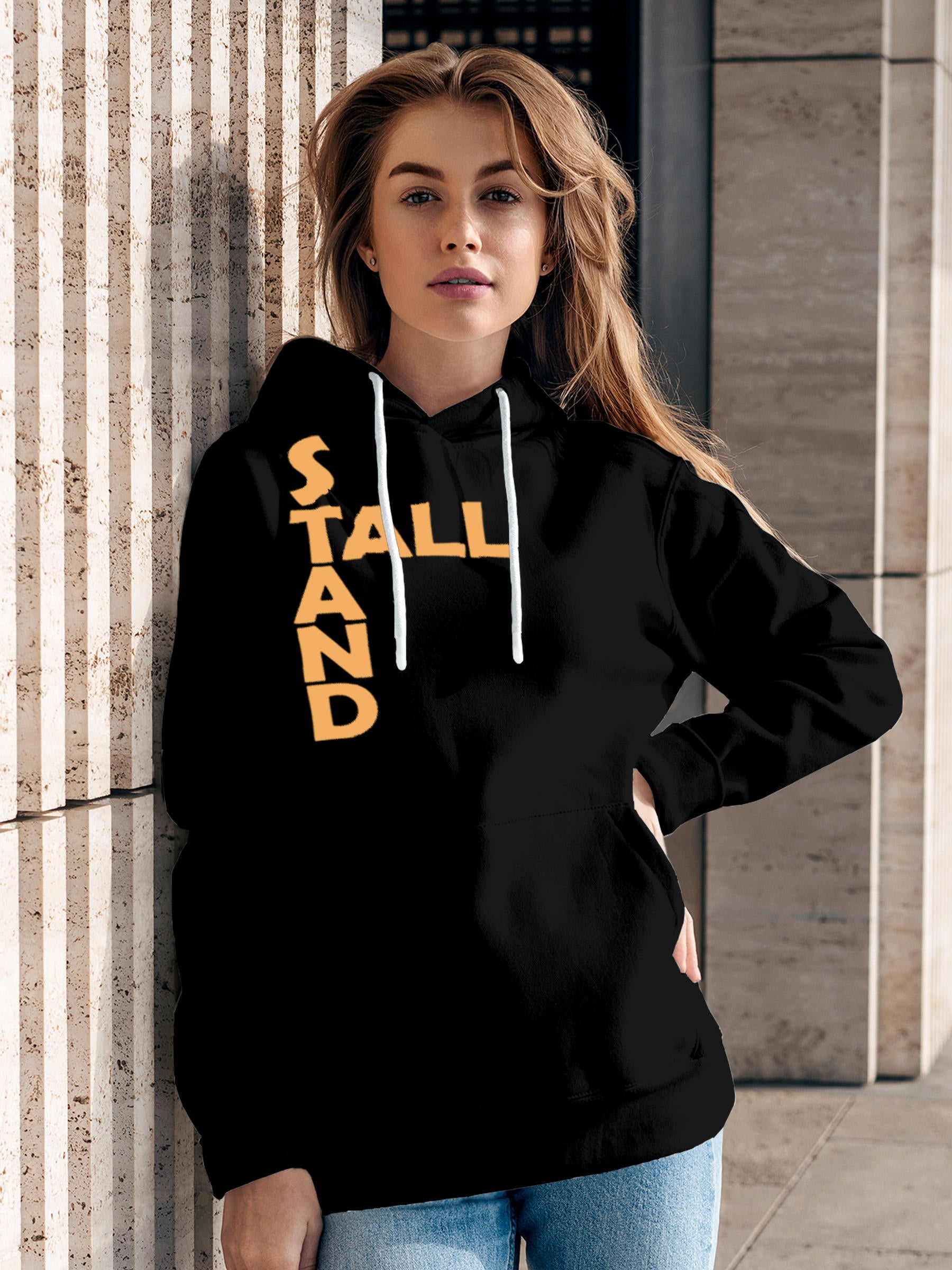 Model wearing Women's Black Hoodie Sweatshirt with 'Stand Tall' design, offering effortless style and premium comfort