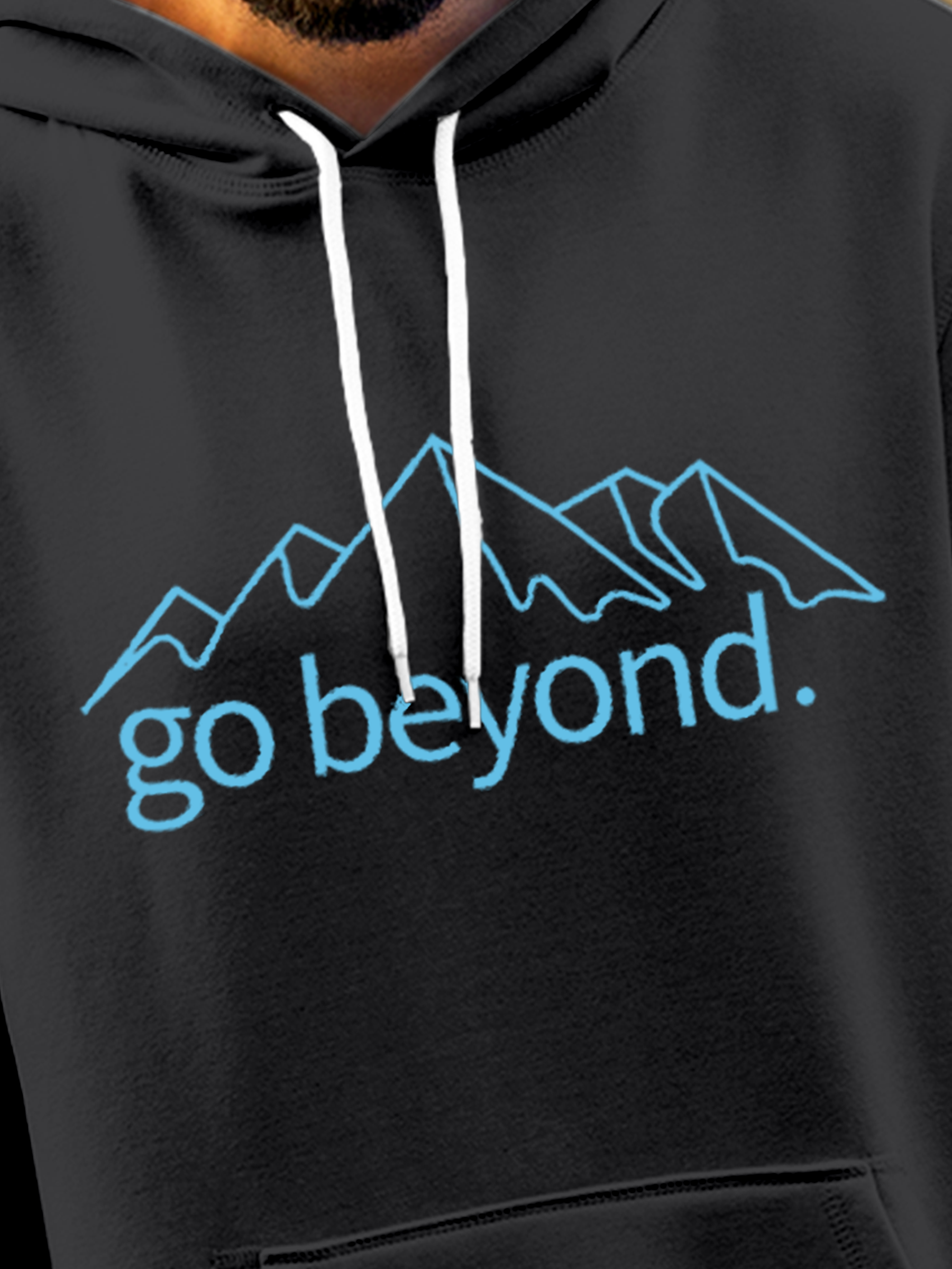 Close up of 'Go Beyond' design on Men's Charcoal Grey Hoodie Sweatshirt, highlighting intricate details and vibrant print.