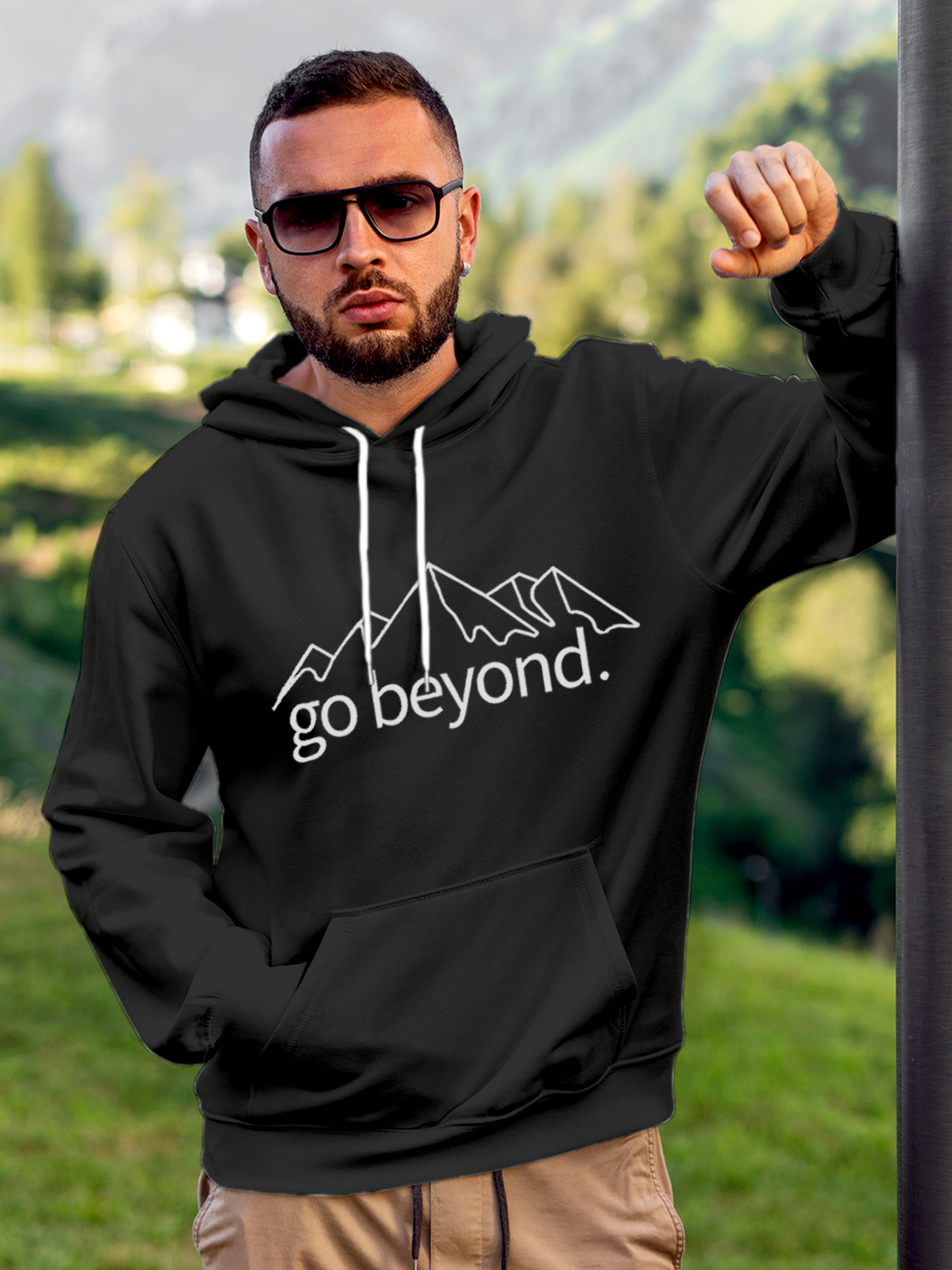 Model wearing Men's Charcoal Grey Hoodie Sweatshirt with 'Go Beyond' design, offering effortless style and premium comfort