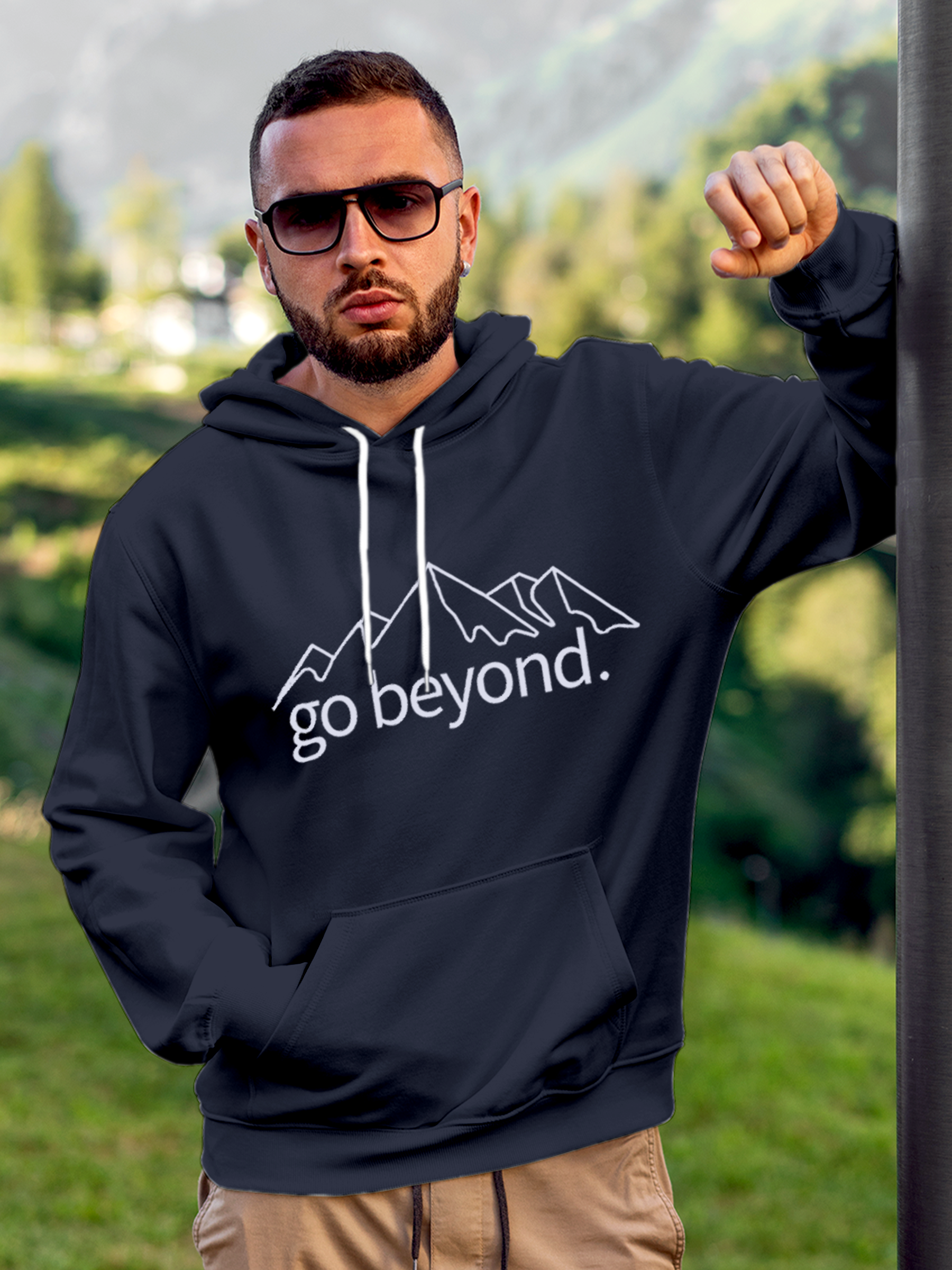 Model wearing Men's Navy Blue Hoodie Sweatshirt with 'Go Beyond' design, offering effortless style and premium comfort