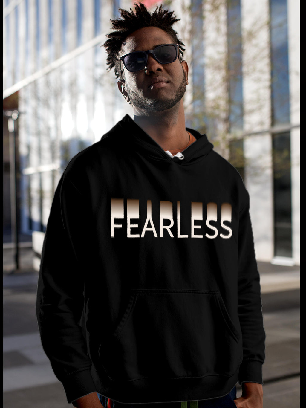 Model wearing Men's Black Hoodie Sweatshirt with 'Fearless' design, offering effortless style and premium comfort