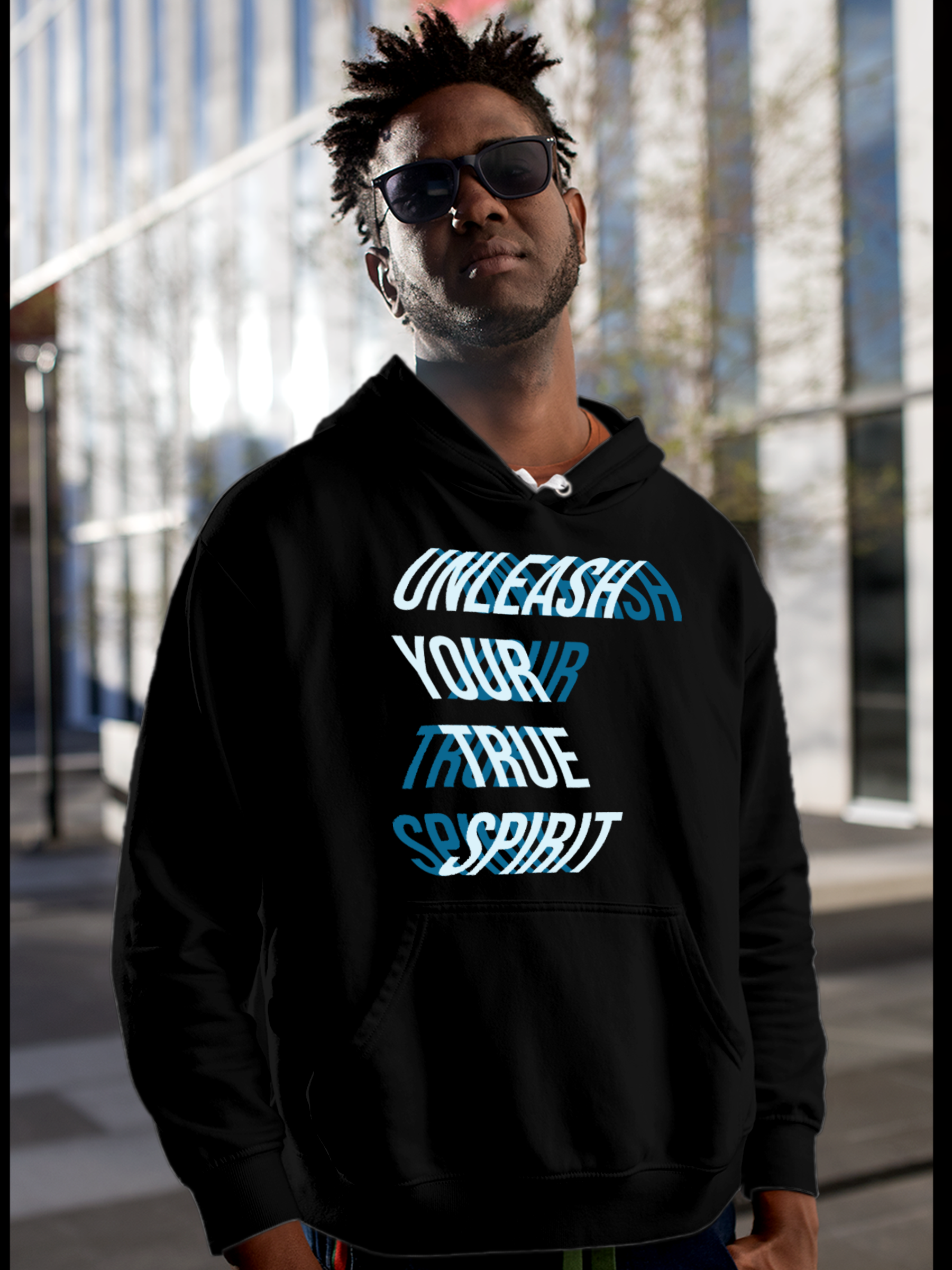 Model wearing Men's Black Hoodie Sweatshirt with 'Unleash Your True Spirit' design, offering effortless style and premium comfort