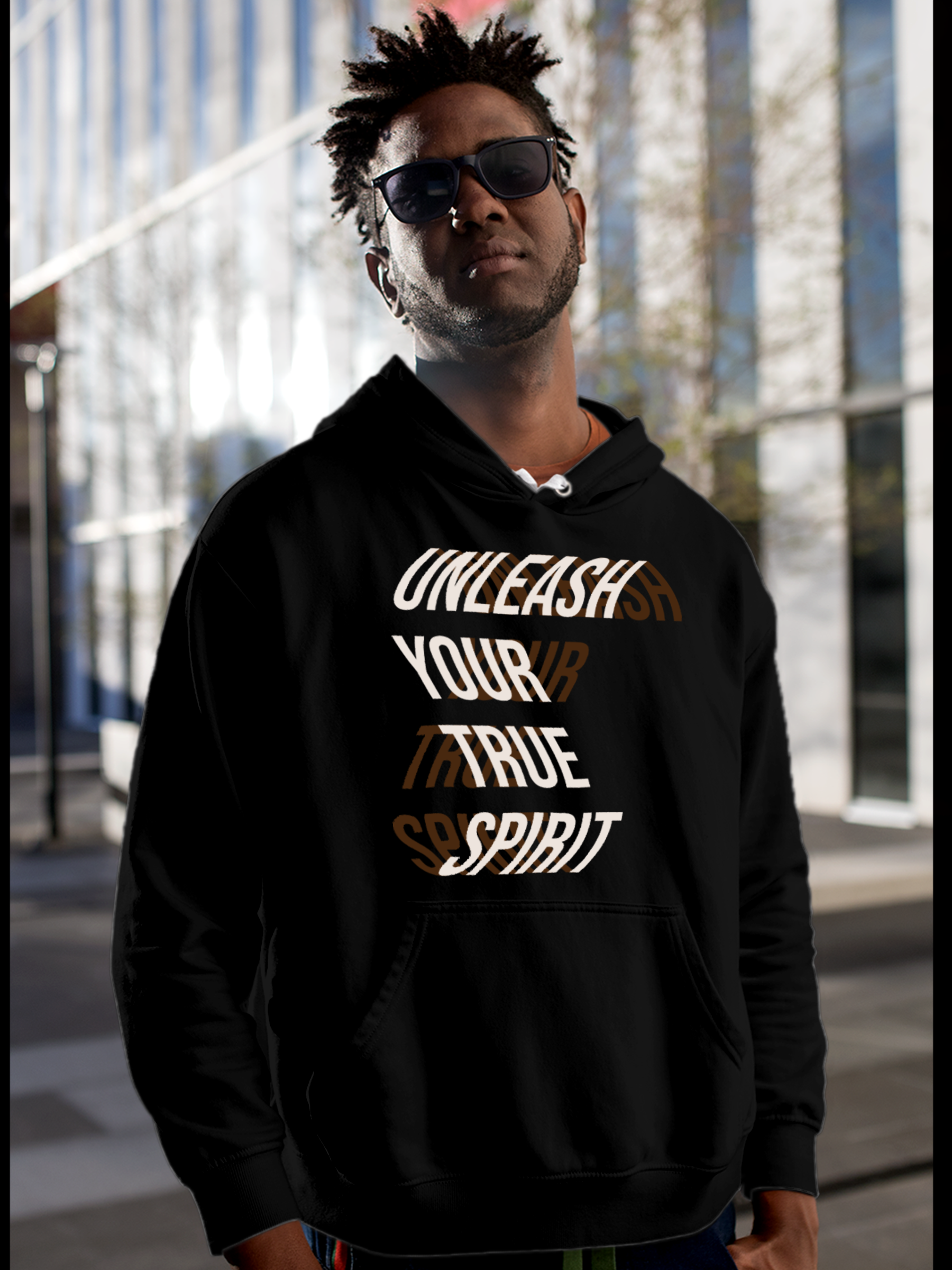 Model wearing Men's Black Hoodie Sweatshirt with 'Unleash Your True Spirit' design, offering effortless style and premium comfort