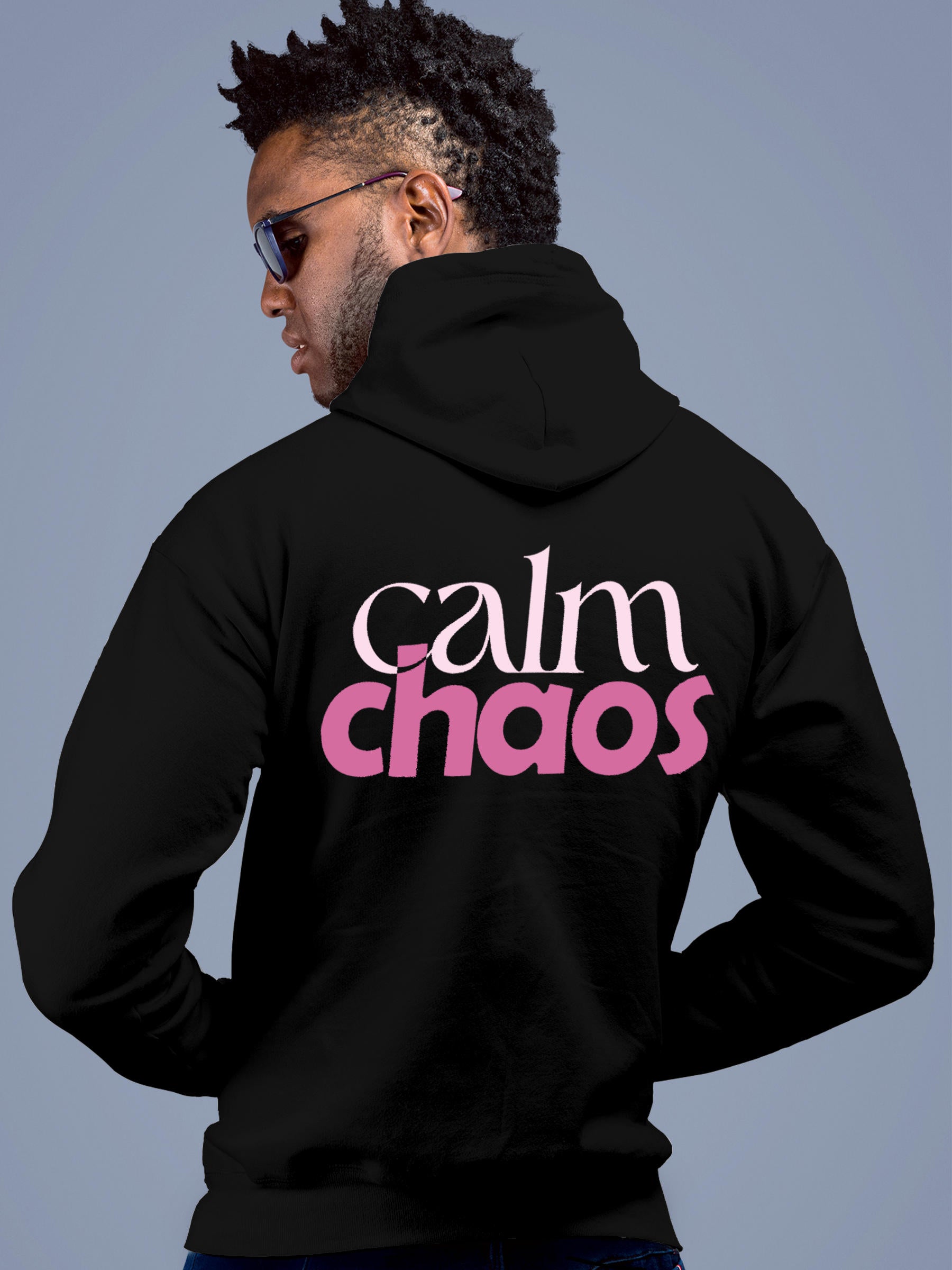 Model wearing Men's Black Hoodie Sweatshirt with 'Calm Chaos' design, offering effortless style and premium comfort