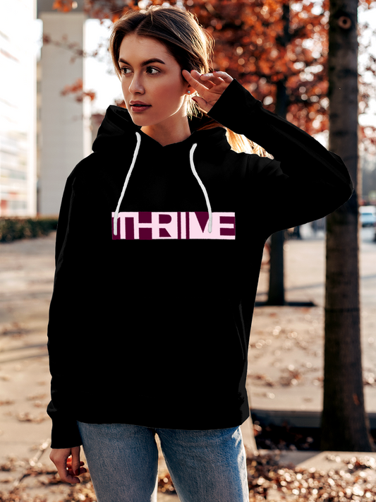 Fighterhero Hoodie Collection: Model wearing Women's Black Hoodie Sweatshirt with 'Thrive' design