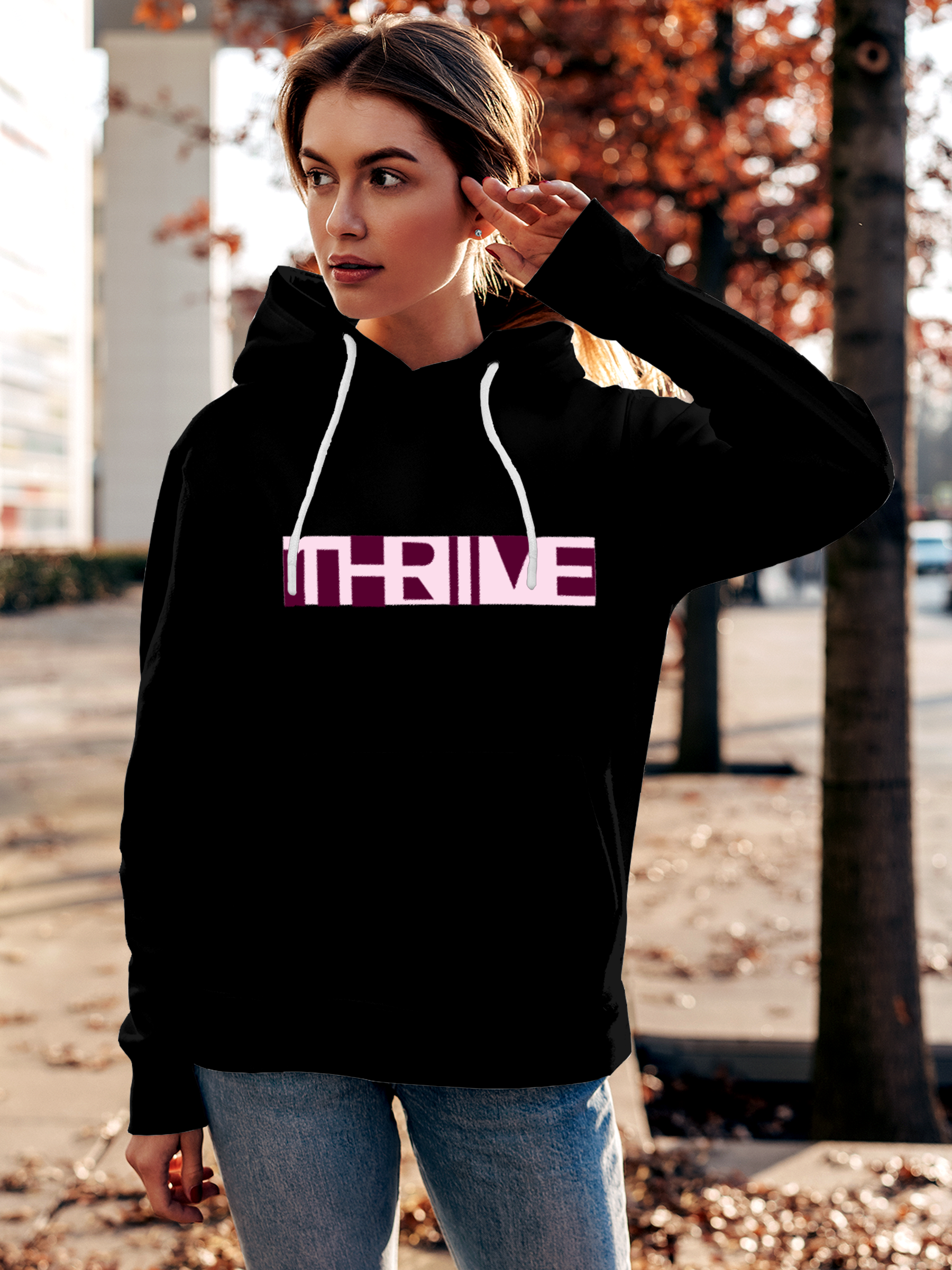 Model wearing Women's Black Hoodie Sweatshirt with 'Thrive' design, offering effortless style and premium comfort
