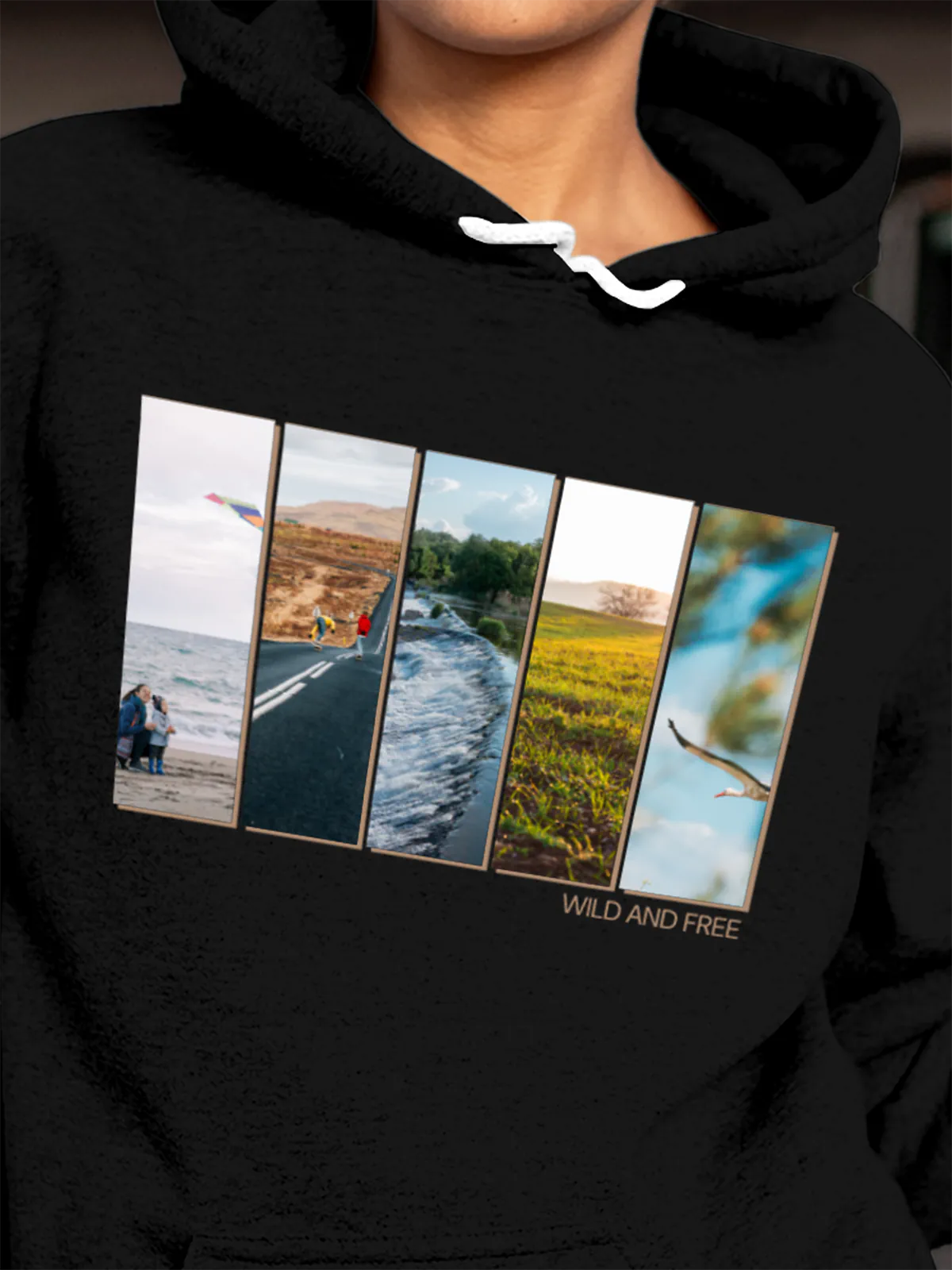 Close up of 'Wild & Free' design on Women's Black Hoodie Sweatshirt, highlighting intricate details and vibrant print.