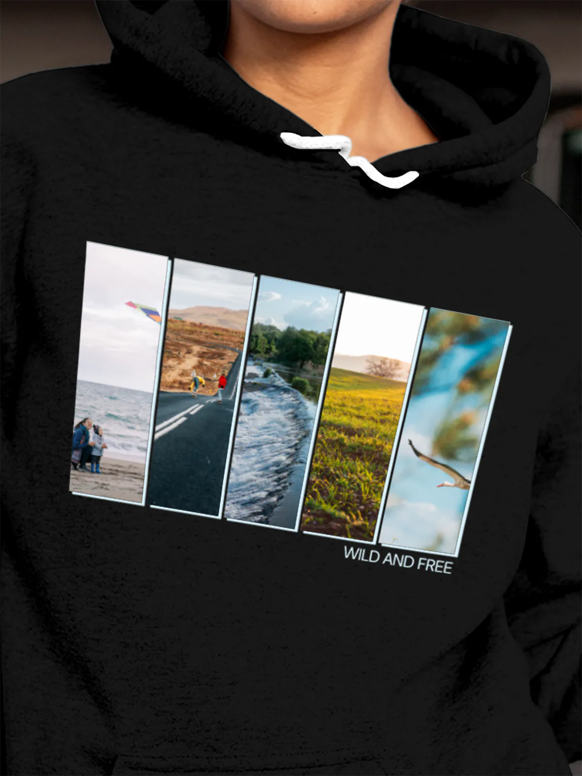 Close up of 'Wild & Free' design on Women's Black Hoodie Sweatshirt, highlighting intricate details and vibrant print.