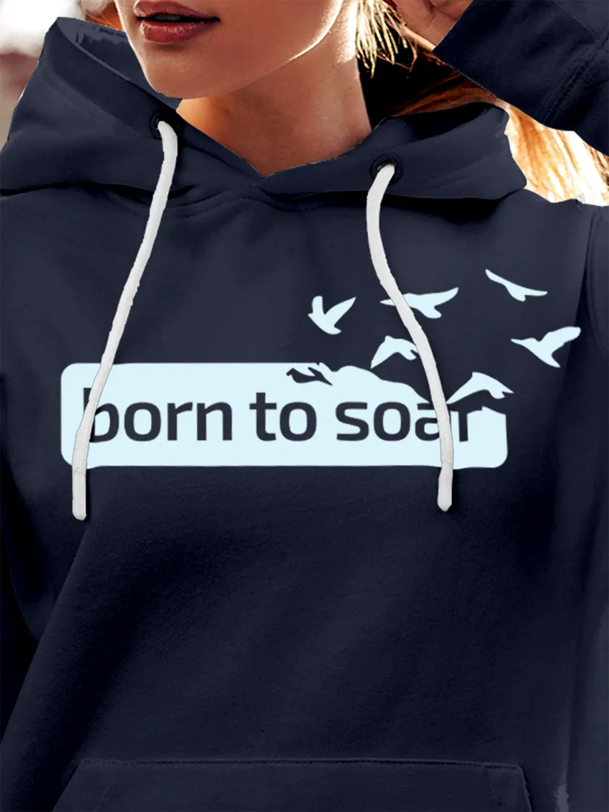 Close up of 'Born To Soar' design on Women's Navy Blue Hoodie Sweatshirt, highlighting intricate details and vibrant print.