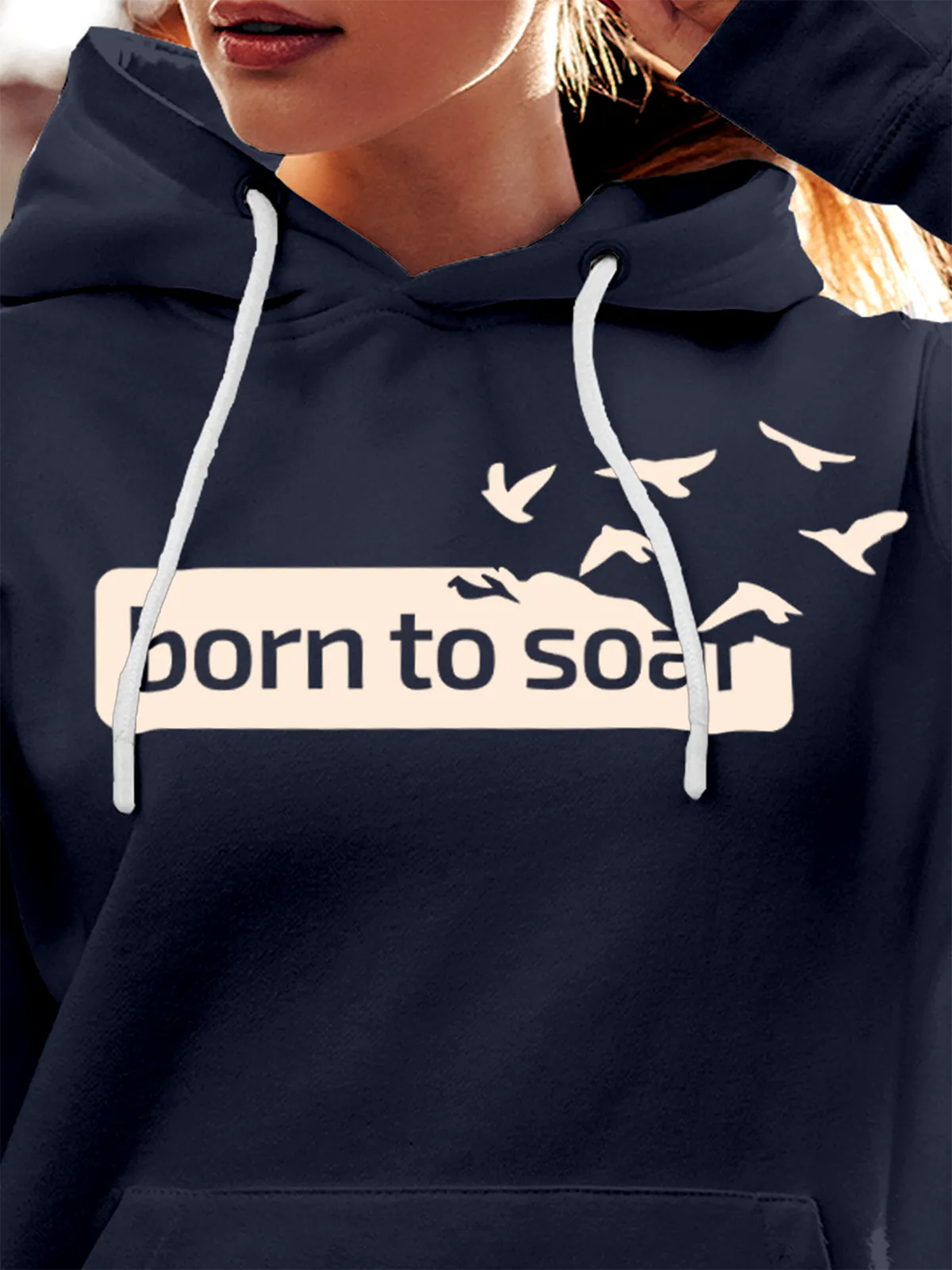 Close up of 'Born To Soar' design on Women's Navy Blue Hoodie Sweatshirt, highlighting intricate details and vibrant print.