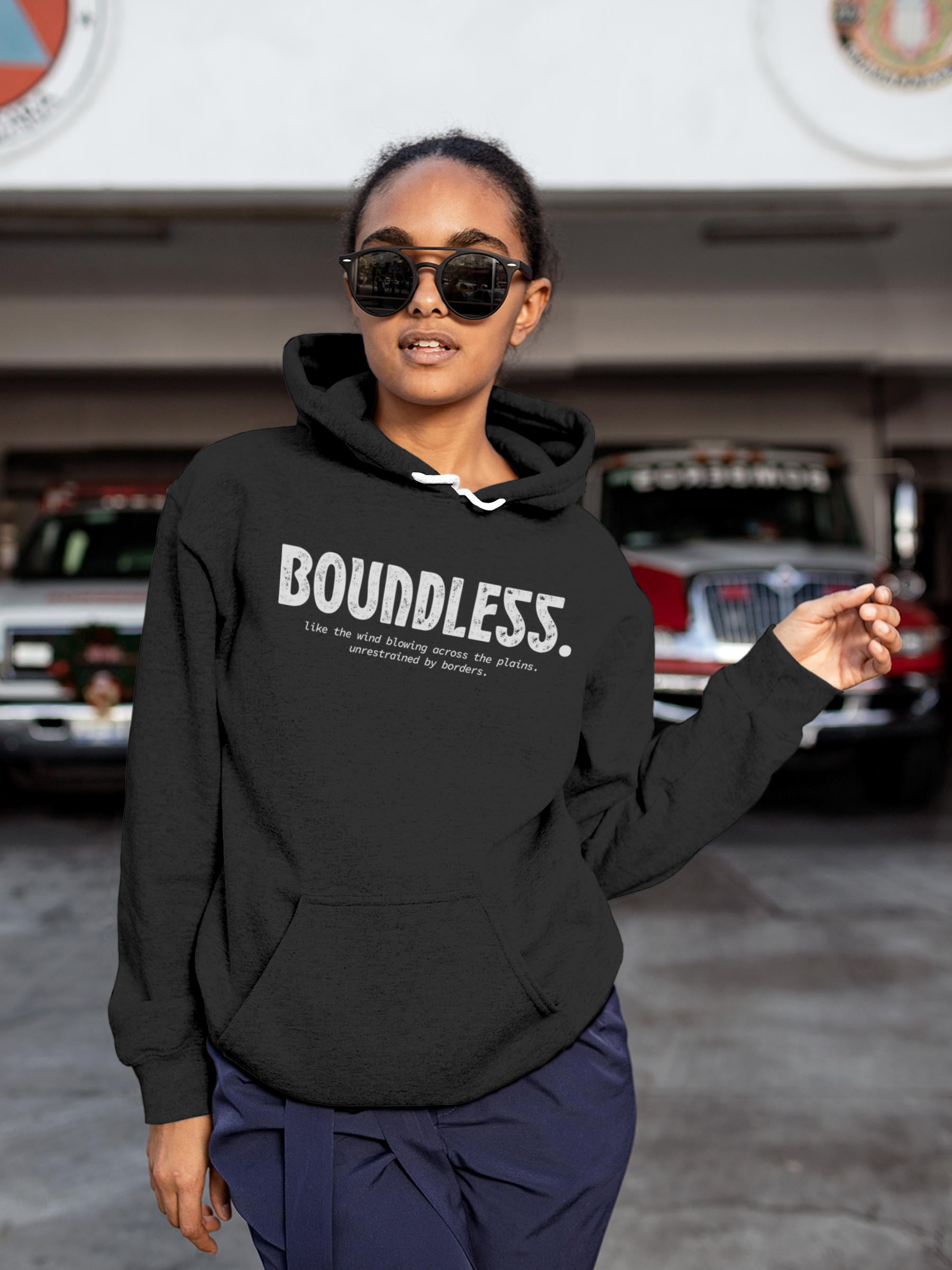 Model wearing Women's Dark Grey Hoodie Sweatshirt with 'Boundless' design, offering effortless style and premium comfort