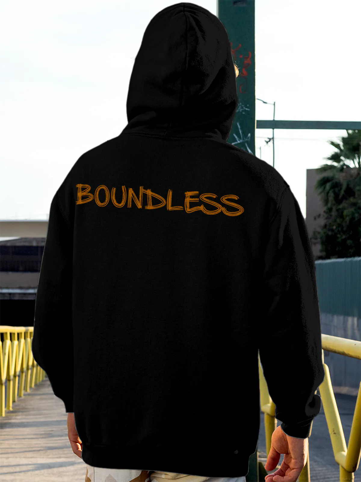 Model wearing Men's Black Hoodie Sweatshirt with 'Boundless' design, offering effortless style and premium comfort