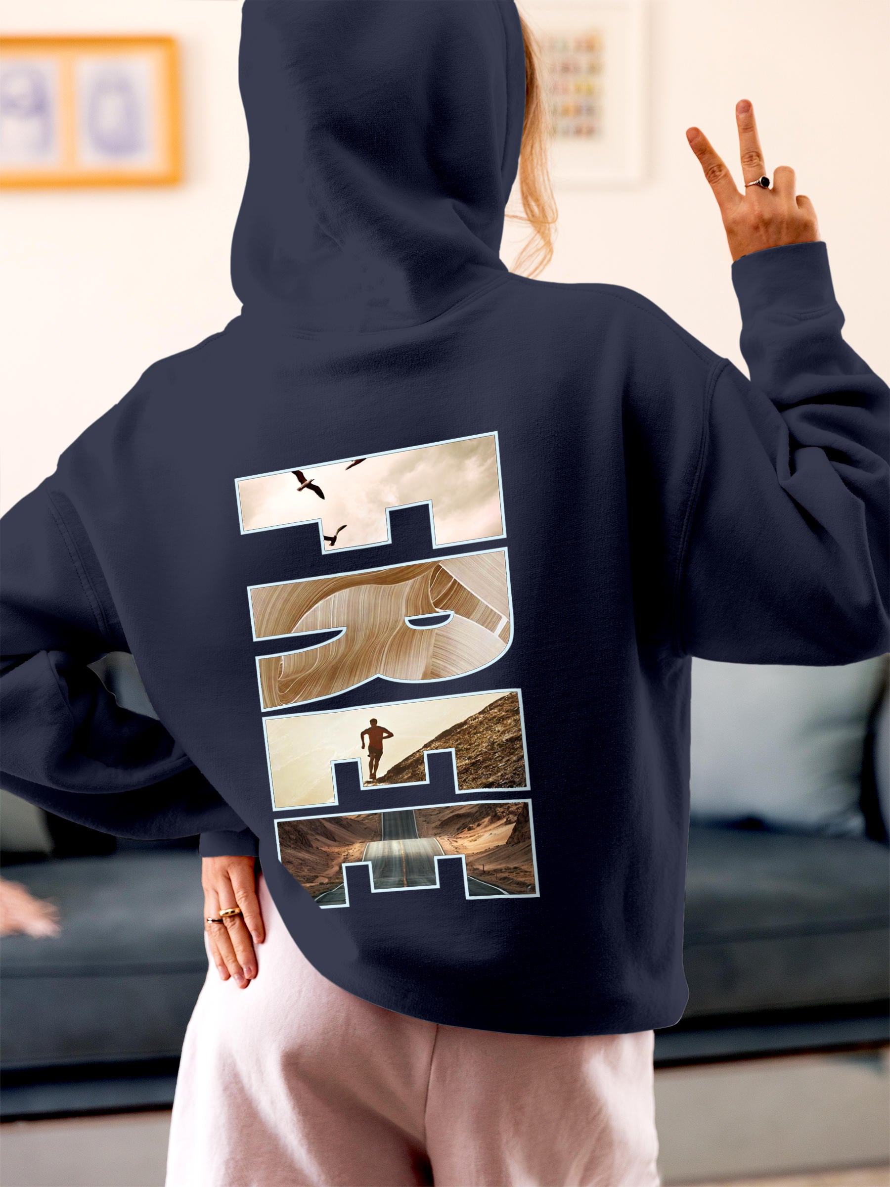 Model wearing Women's Navy Blue Hoodie Sweatshirt with 'Free & Boundless' design, offering effortless style and premium comfort