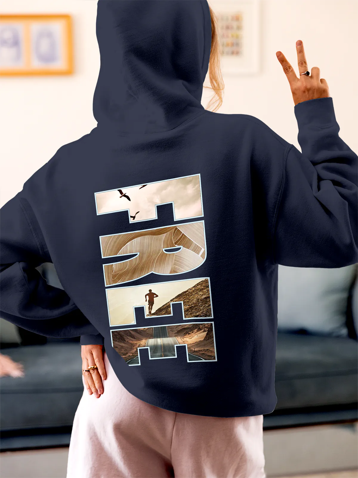 Model wearing Women's Navy Blue Hoodie Sweatshirt with 'Free & Boundless' design, offering effortless style and premium comfort