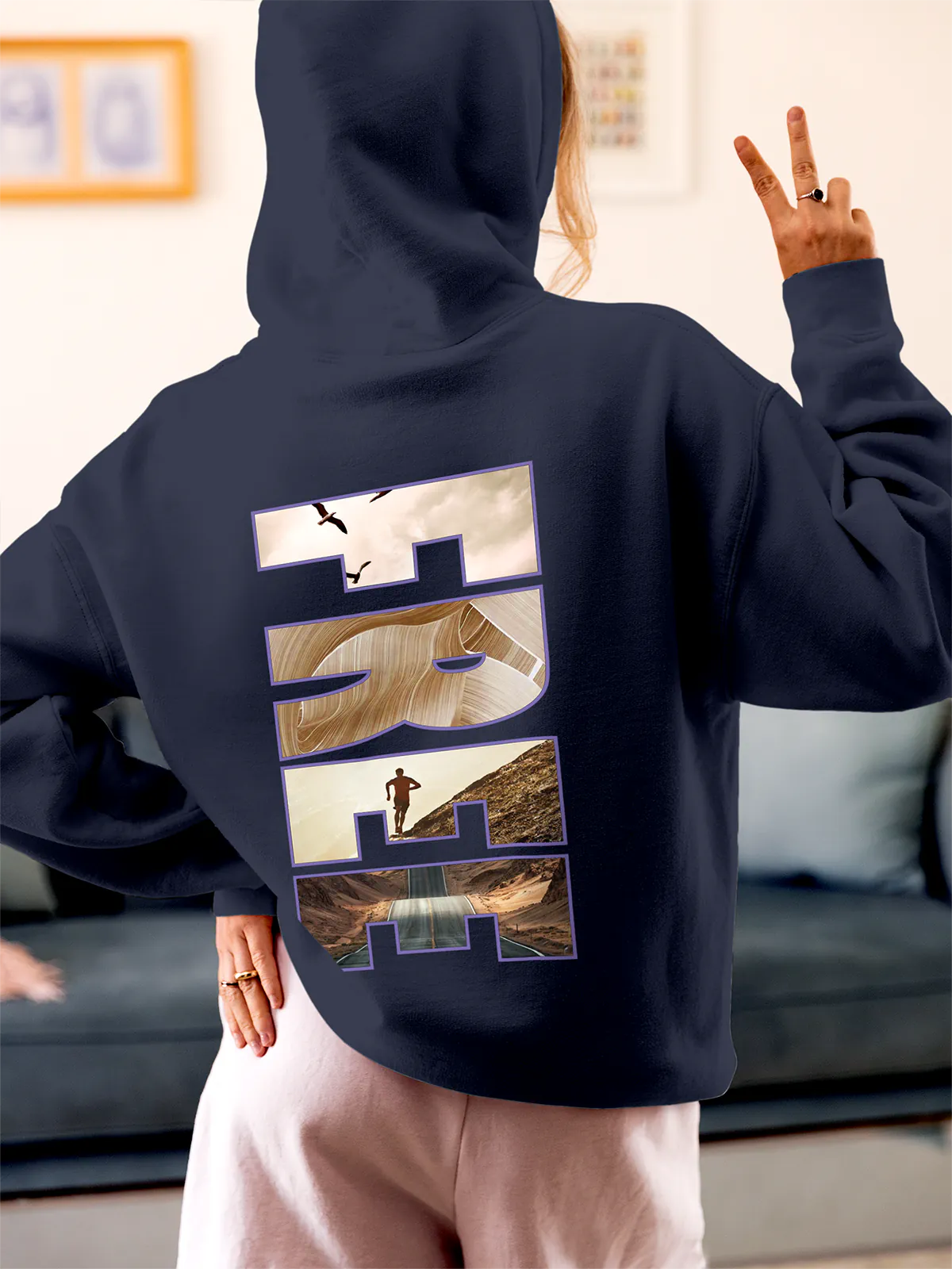 Model wearing Women's Navy Blue Hoodie Sweatshirt with 'Free & Boundless' design, offering effortless style and premium comfort