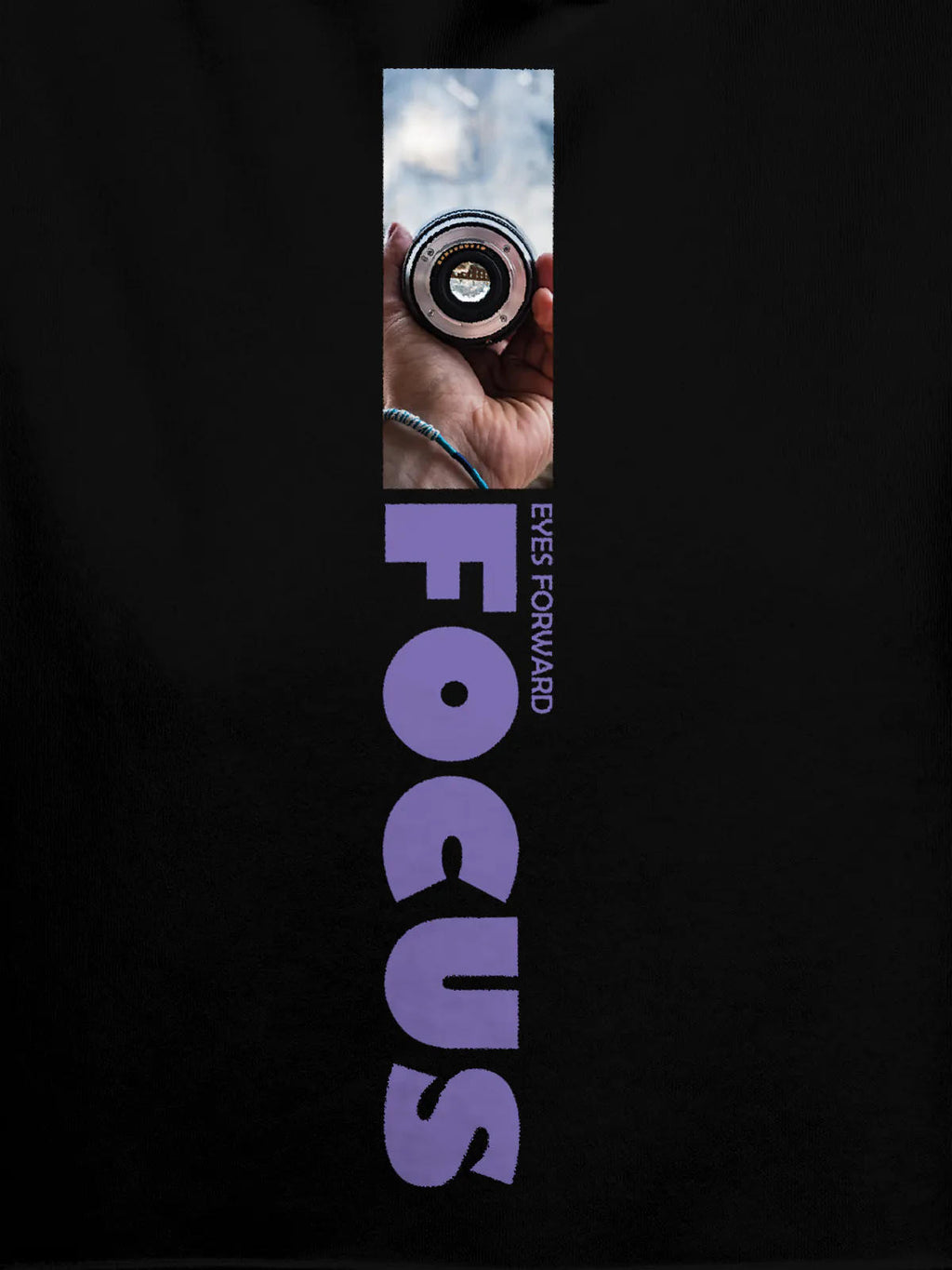 Close up of 'Focus' design on Women's Black Hoodie Sweatshirt, highlighting intricate details and vibrant print.