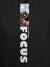 Close up of 'Focus' design on Women's Dark Grey Hoodie Sweatshirt, highlighting intricate details and vibrant print.
