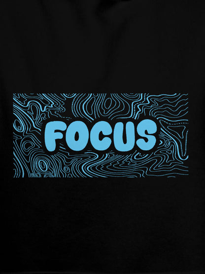 Close up of 'Focus In Chaos' design on Men's Black Hoodie Sweatshirt, highlighting intricate details and vibrant print.