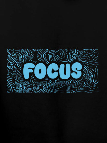 Close up of 'Focus In Chaos' design on Women's Black Hoodie Sweatshirt, highlighting intricate details and vibrant print.