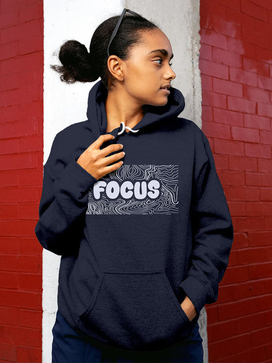 Model wearing Women's Navy Blue Hoodie Sweatshirt with 'Focus In Chaos' design, offering effortless style and premium comfort