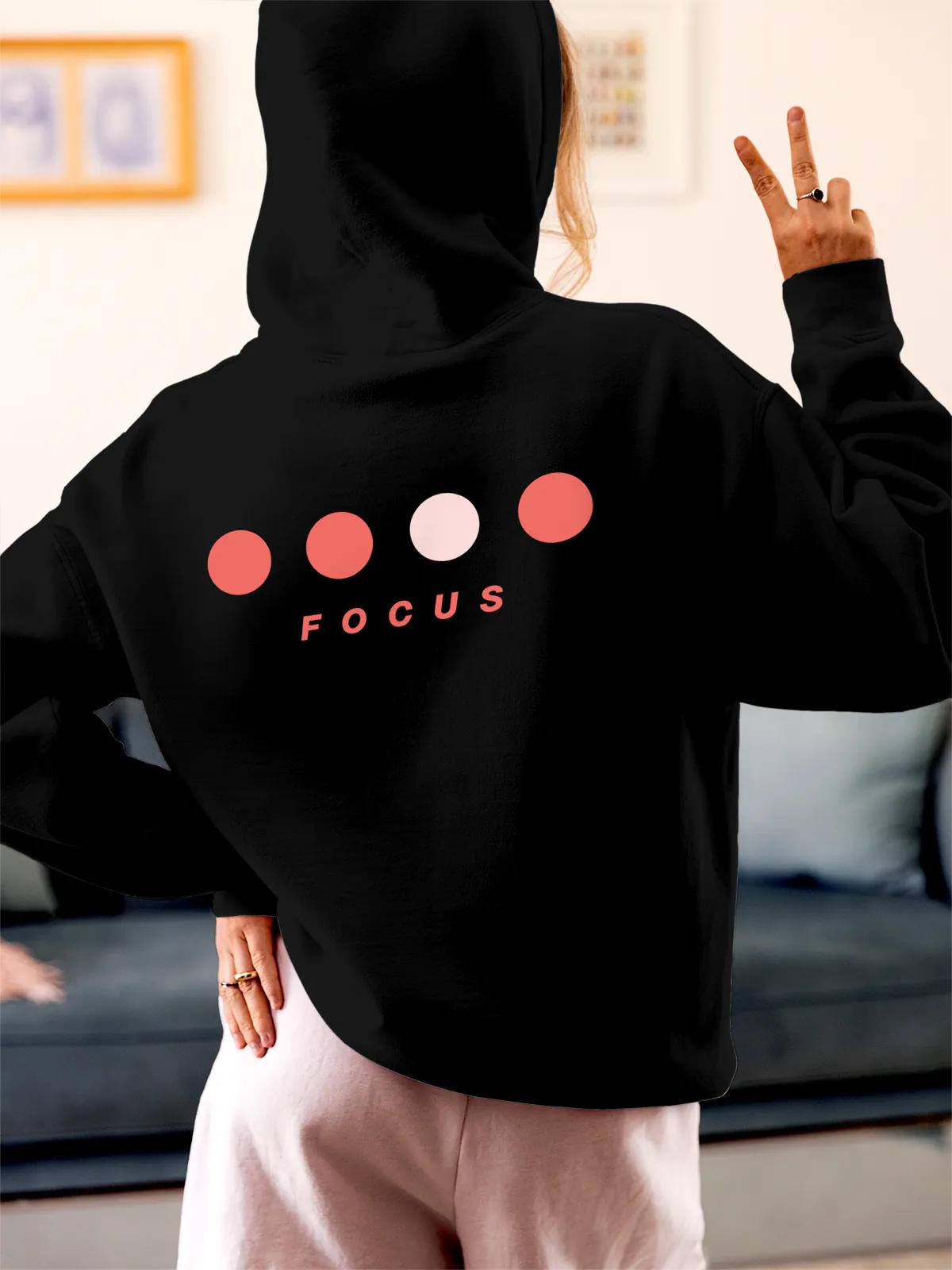 Model wearing Women's Black Hoodie Sweatshirt with 'Focus On Goal' design, offering effortless style and premium comfort