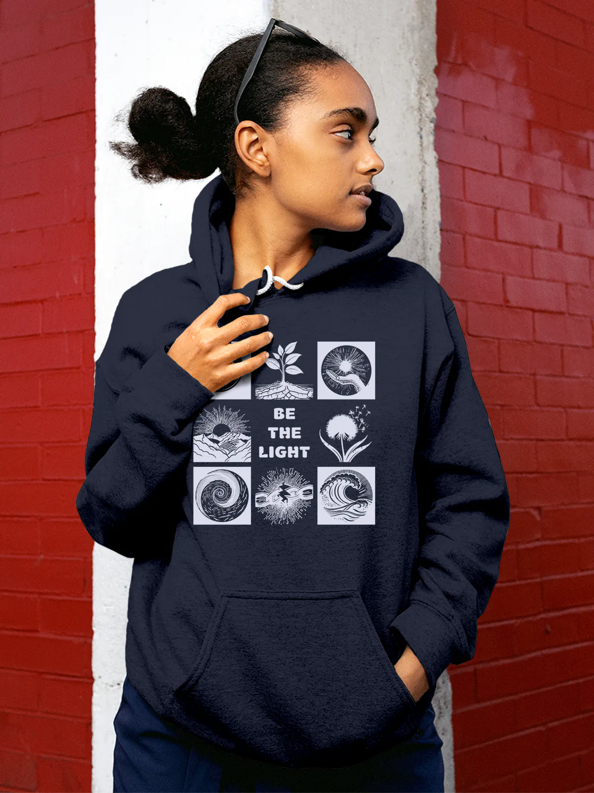 Model wearing Women's Navy Blue Hoodie Sweatshirt with 'Be The Light' design, offering effortless style and premium comfort