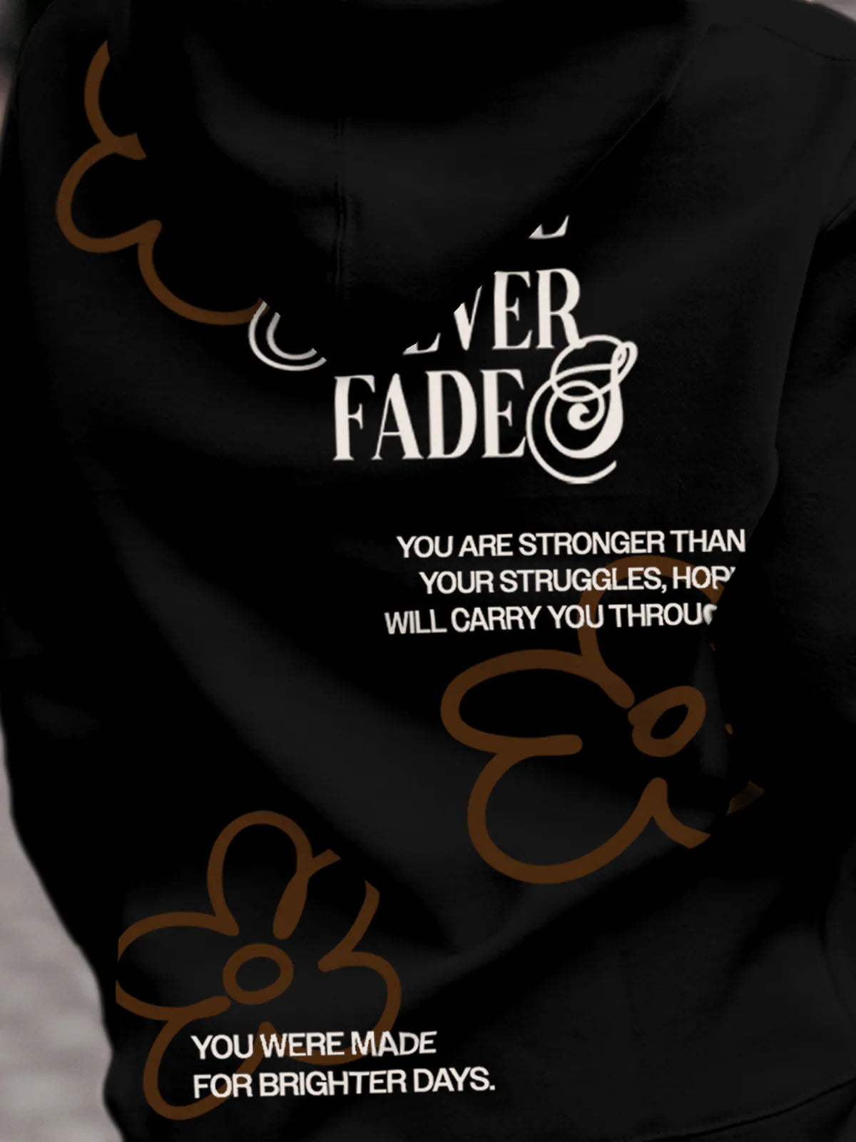 Close up of 'Hope Never Fades' design on Women's Black Hoodie Sweatshirt, highlighting intricate details and vibrant print.