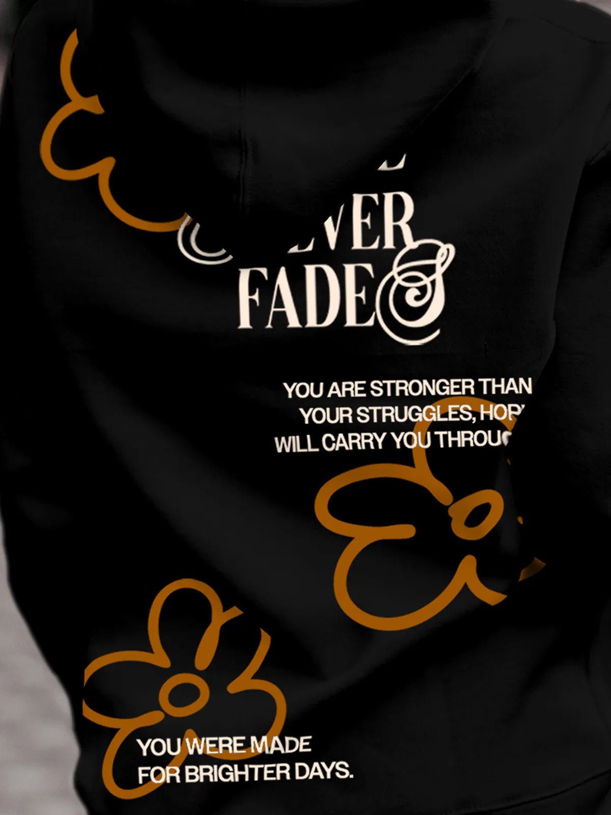 Close up of 'Hope Never Fades' design on Women's Black Hoodie Sweatshirt, highlighting intricate details and vibrant print.