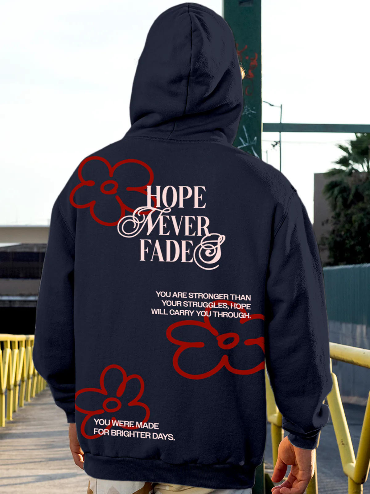 Model wearing Men's Navy Blue Hoodie Sweatshirt with 'Hope Never Fades' design, offering effortless style and premium comfort