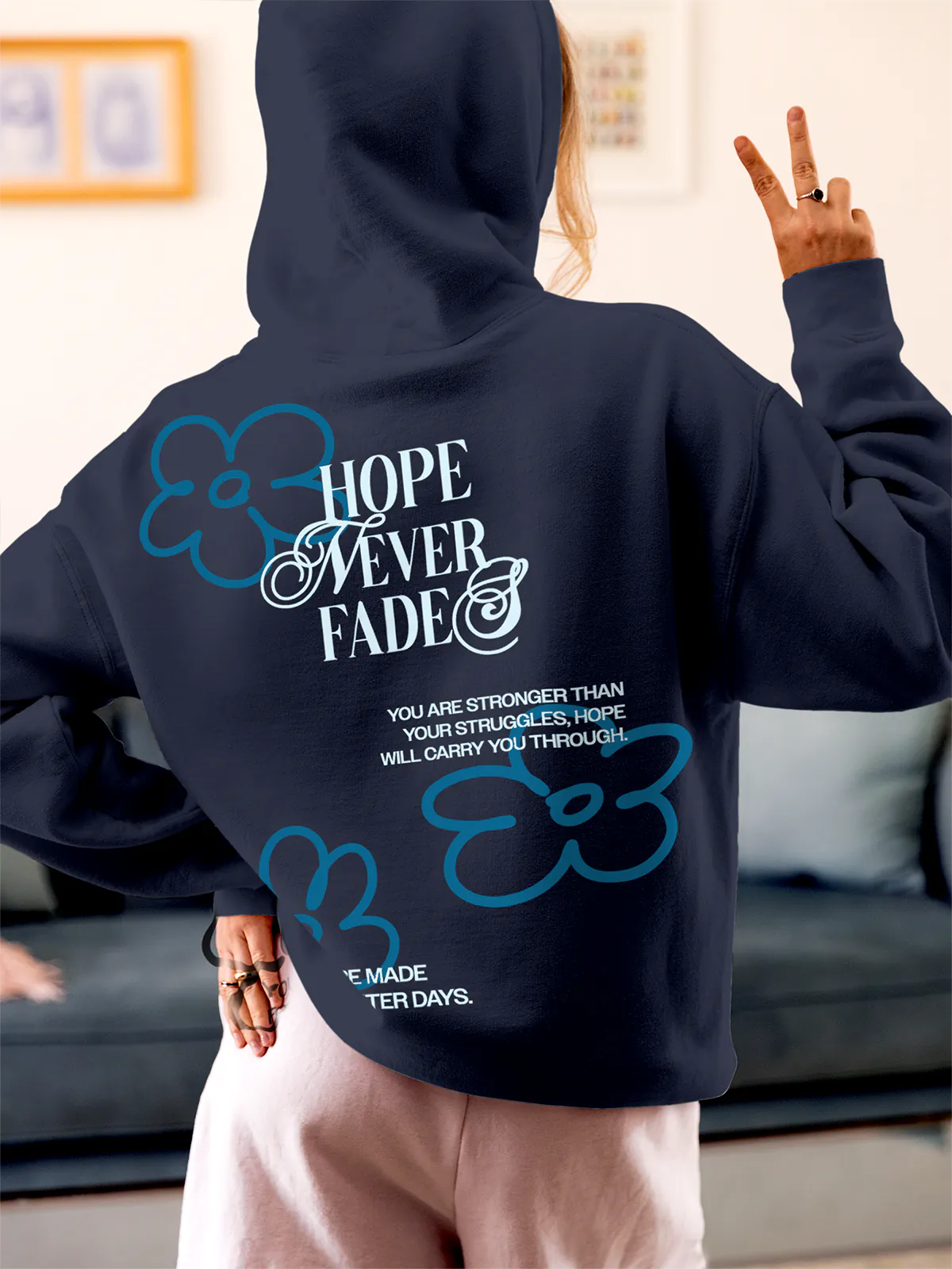 Model wearing Women's Navy Blue Hoodie Sweatshirt with 'Hope Never Fades' design, offering effortless style and premium comfort