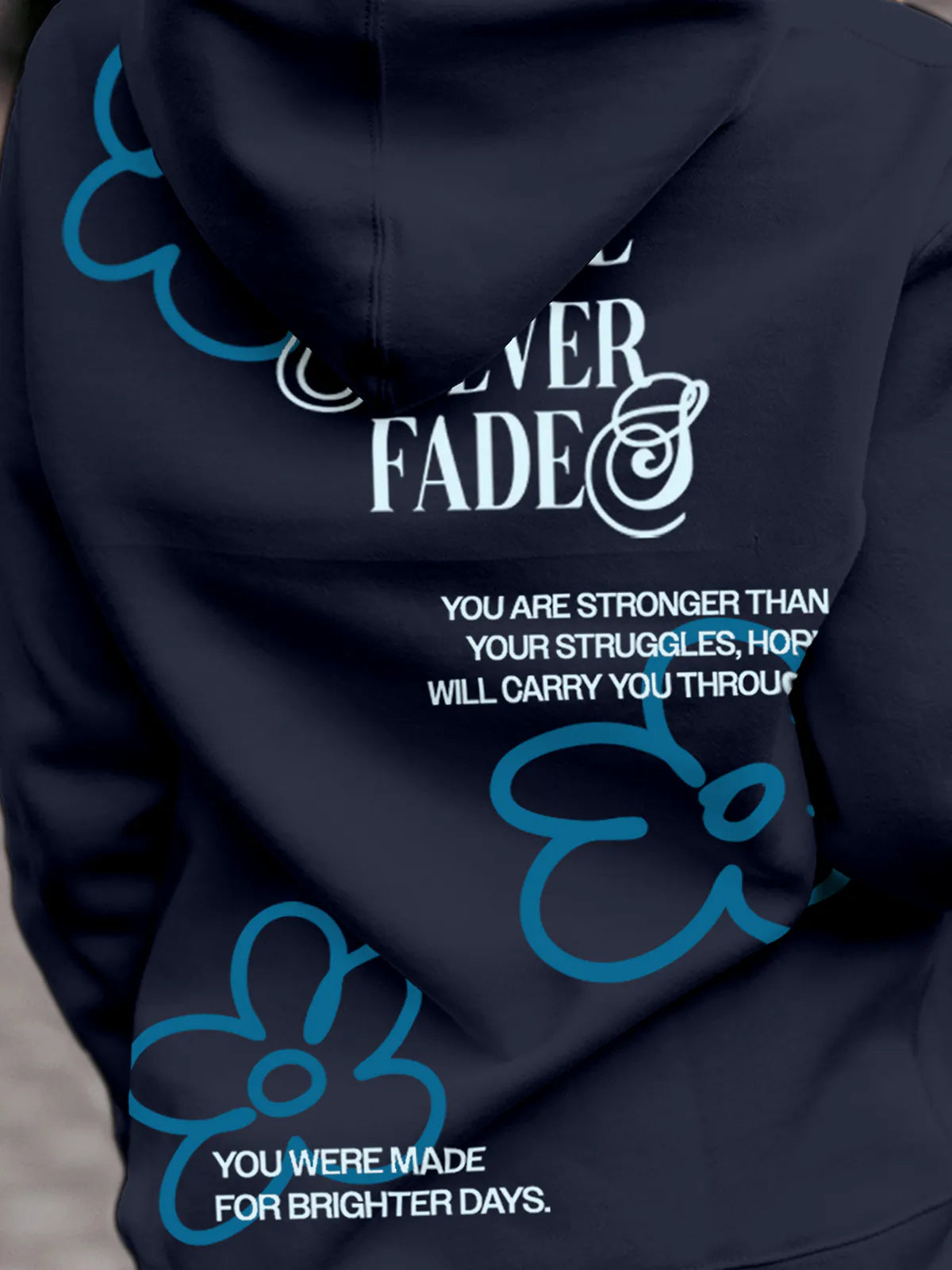 Close up of 'Hope Never Fades' design on Women's Navy Blue Hoodie Sweatshirt, highlighting intricate details and vibrant print.