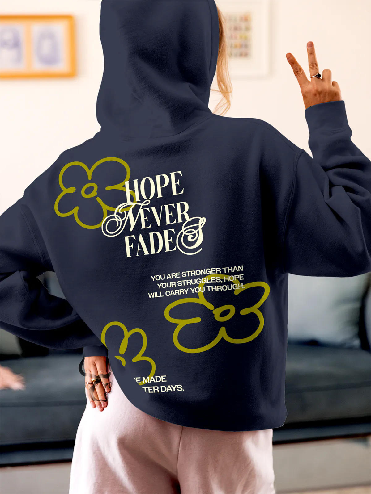 Model wearing Women's Navy Blue Hoodie Sweatshirt with 'Hope Never Fades' design, offering effortless style and premium comfort
