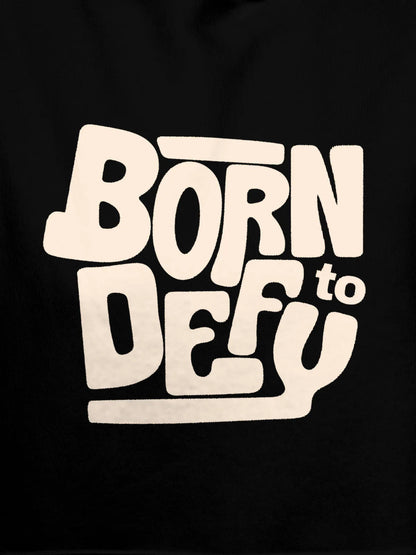 Close up of 'Born To Defy' design on Men's Black Hoodie Sweatshirt, highlighting intricate details and vibrant print.