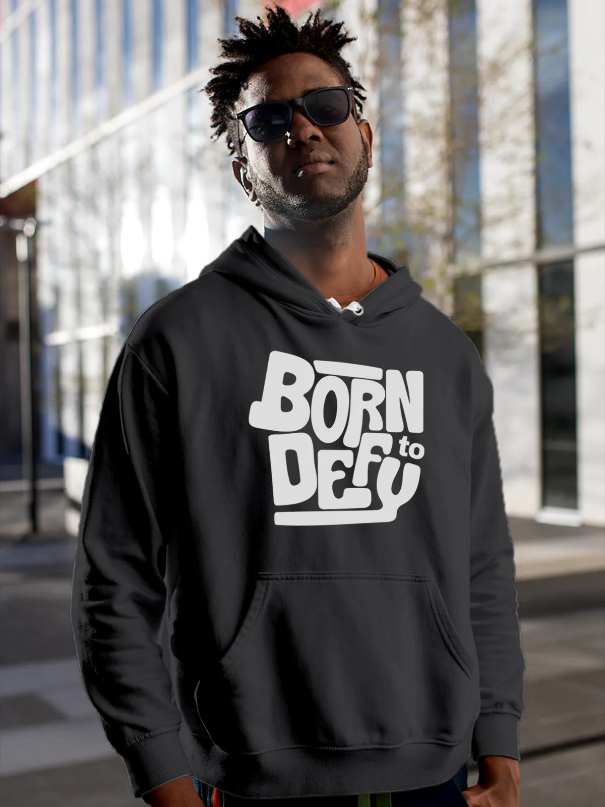 Model wearing Men's Dark Grey Hoodie Sweatshirt with 'Born To Defy' design, offering effortless style and premium comfort