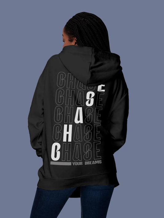 Model wearing Women's Dark Grey Hoodie Sweatshirt with 'Chase Your Dreams' design, offering effortless style and premium comfort