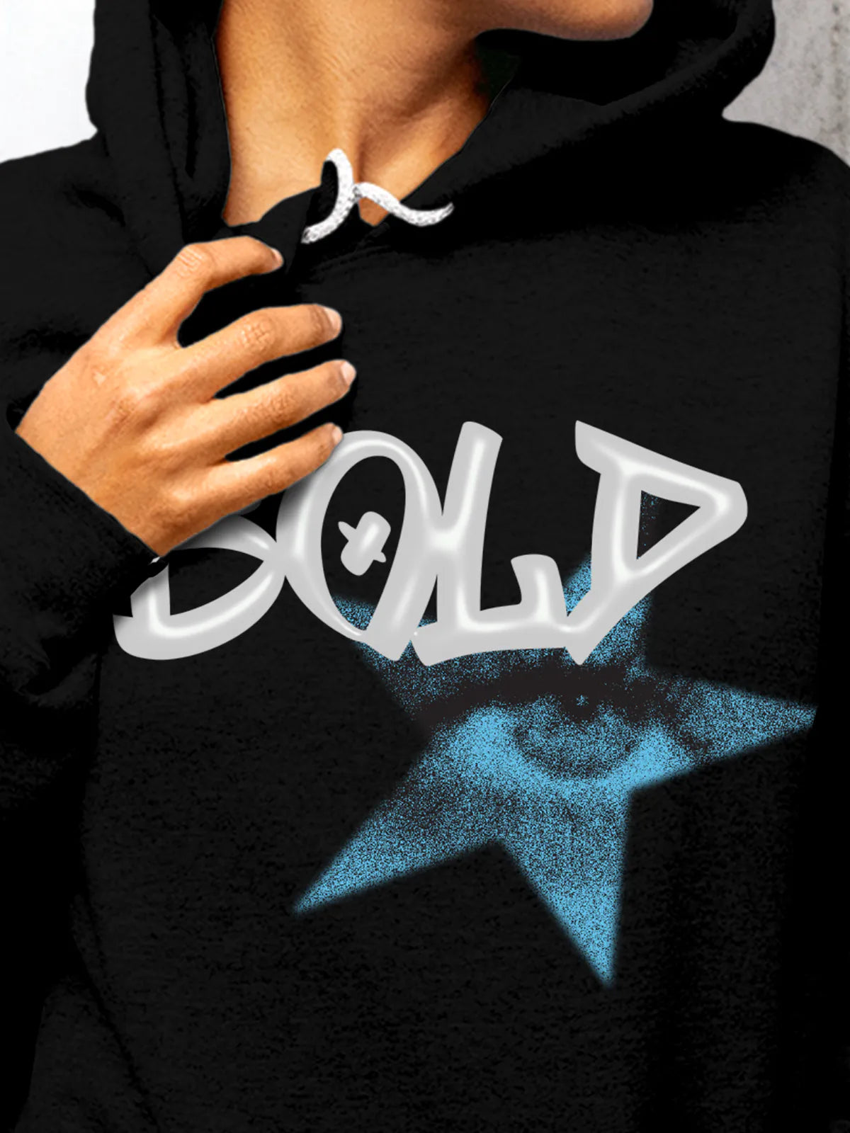 Close up of 'Bold' design on Women's Black Hoodie Sweatshirt, highlighting intricate details and vibrant print.