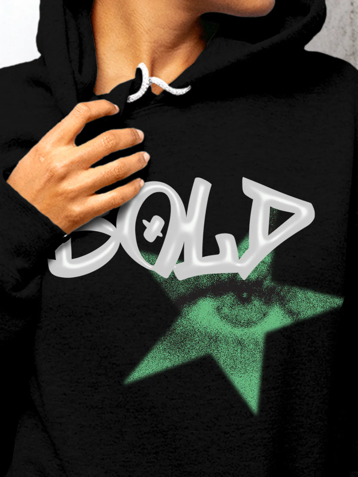 Close up of 'Bold' design on Women's Black Hoodie Sweatshirt, highlighting intricate details and vibrant print.