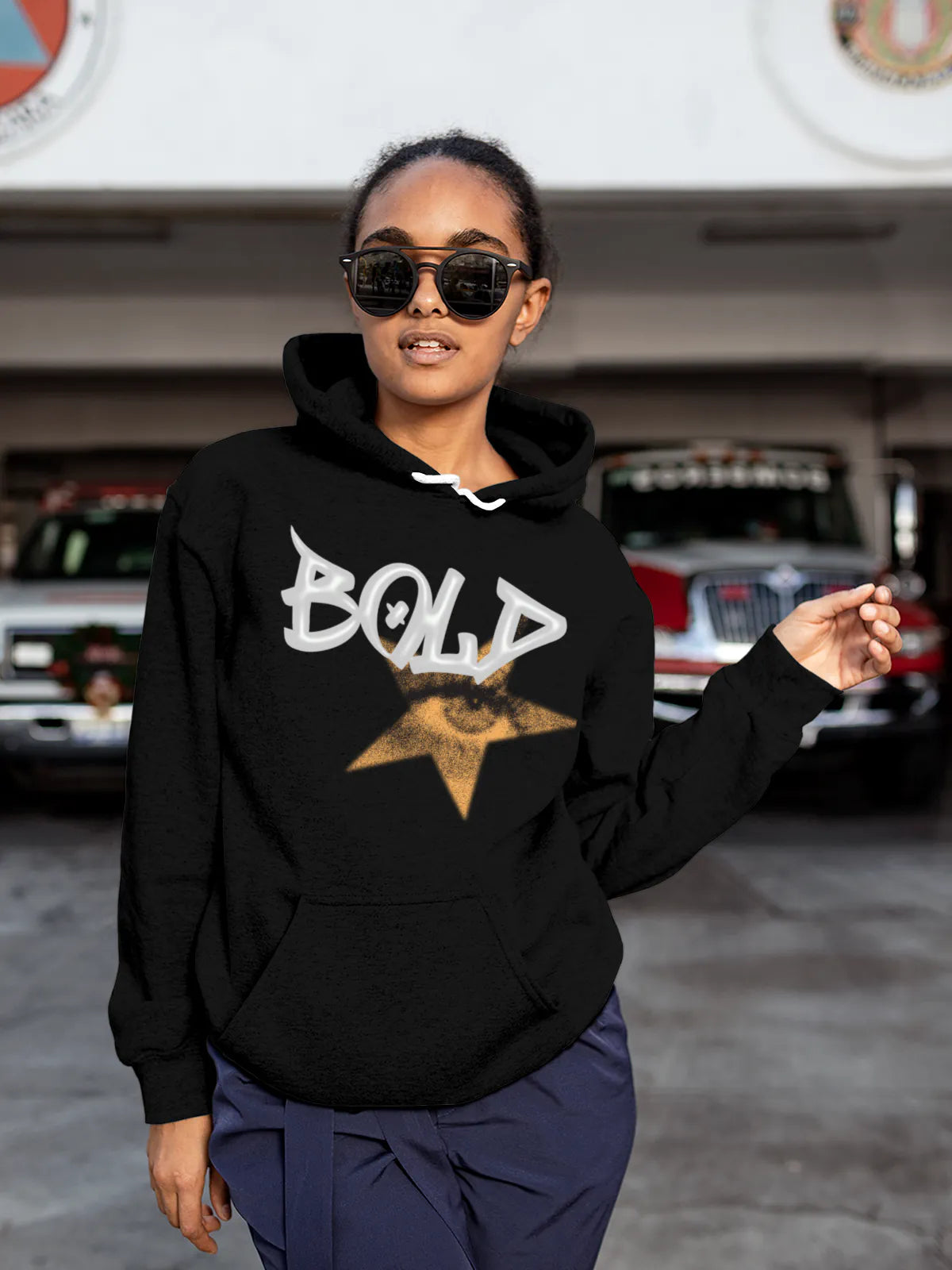 Model wearing Women's Black Hoodie Sweatshirt with 'Bold' design, offering effortless style and premium comfort