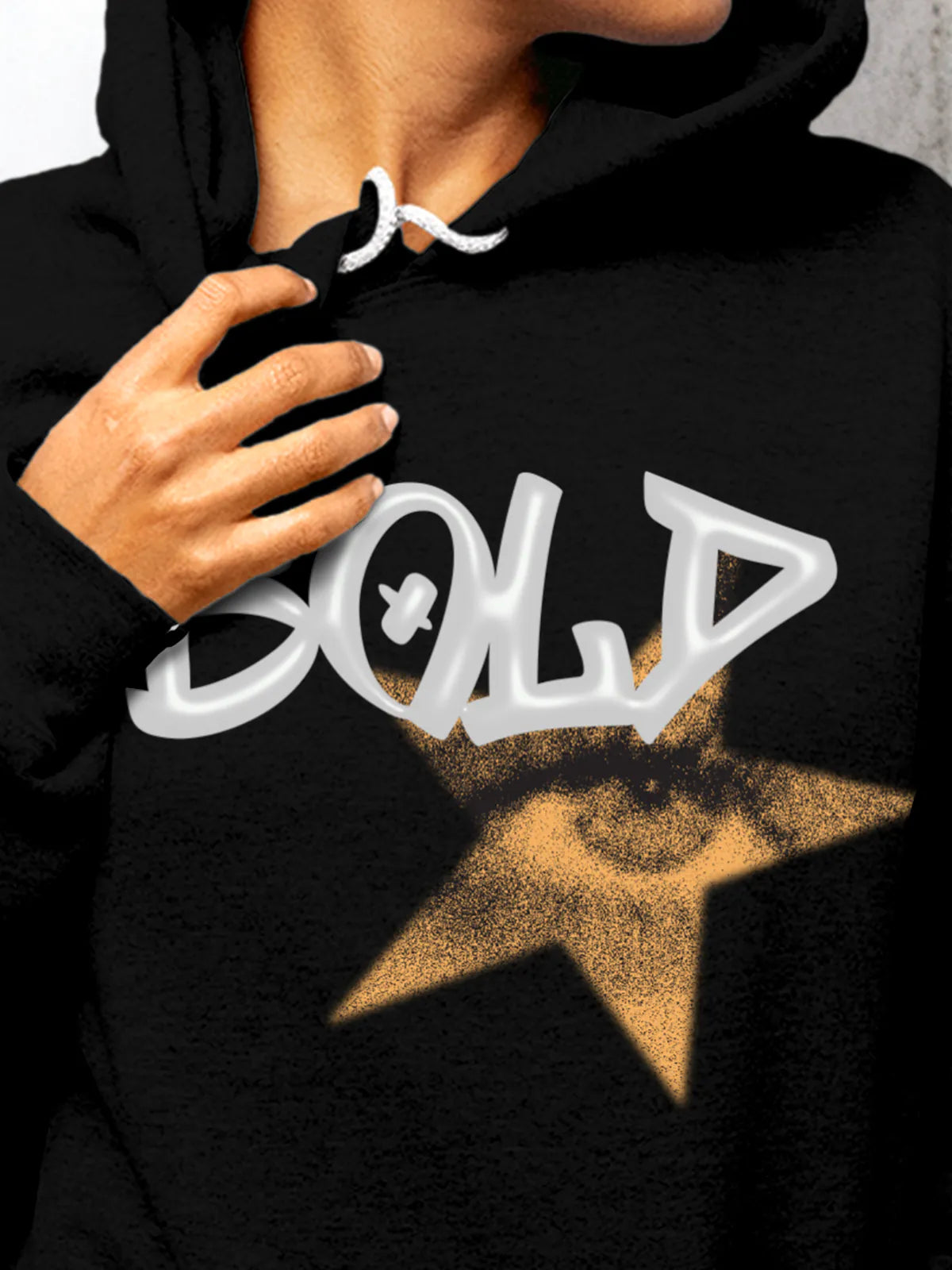 Close up of 'Bold' design on Women's Black Hoodie Sweatshirt, highlighting intricate details and vibrant print.