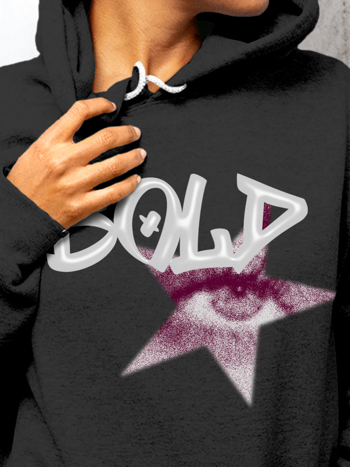 Close up of 'Bold' design on Women's Dark Grey Hoodie Sweatshirt, highlighting intricate details and vibrant print.