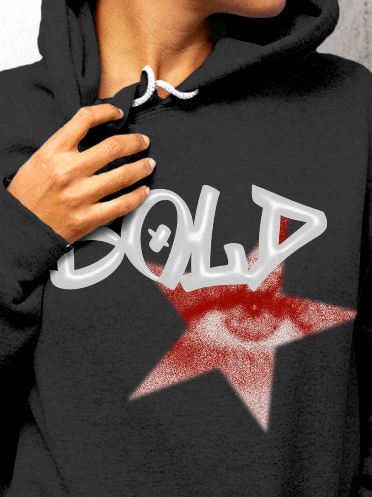 Close up of 'Bold' design on Women's Dark Grey Hoodie Sweatshirt, highlighting intricate details and vibrant print.