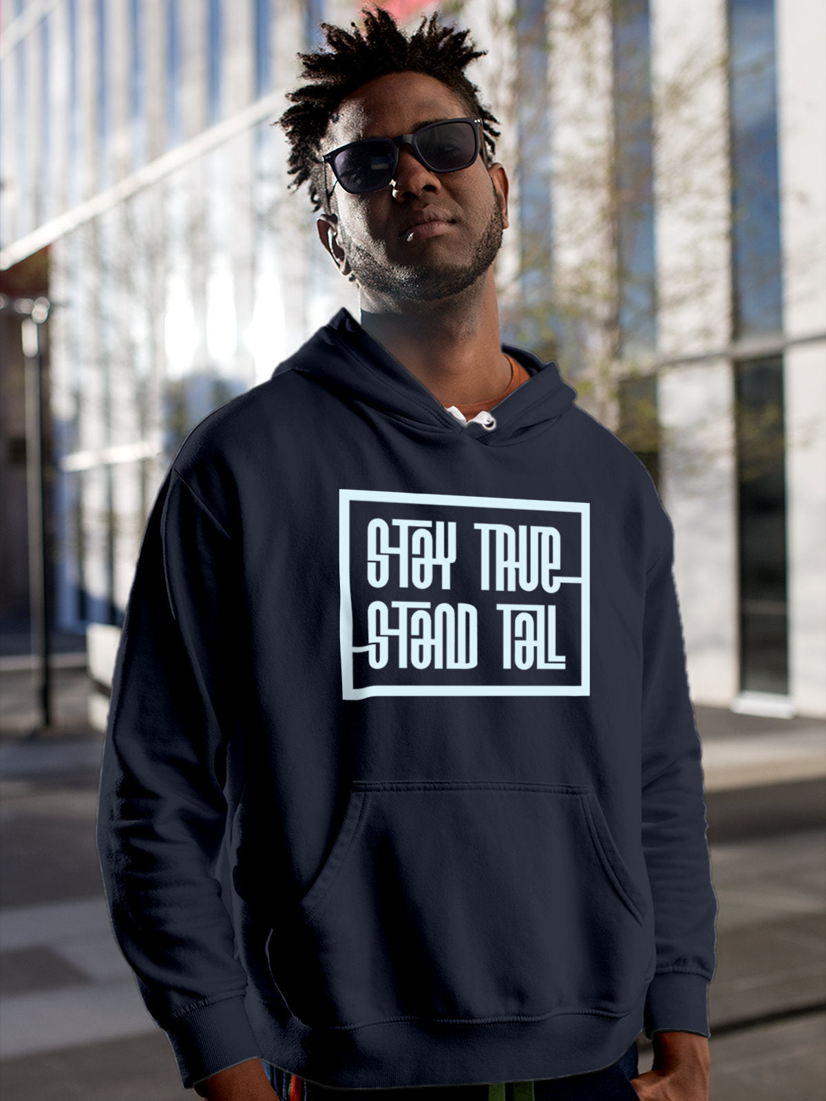 Model wearing Men's Navy Blue Hoodie Sweatshirt with 'Stay True Stand Tall' design, offering effortless style and premium comfort