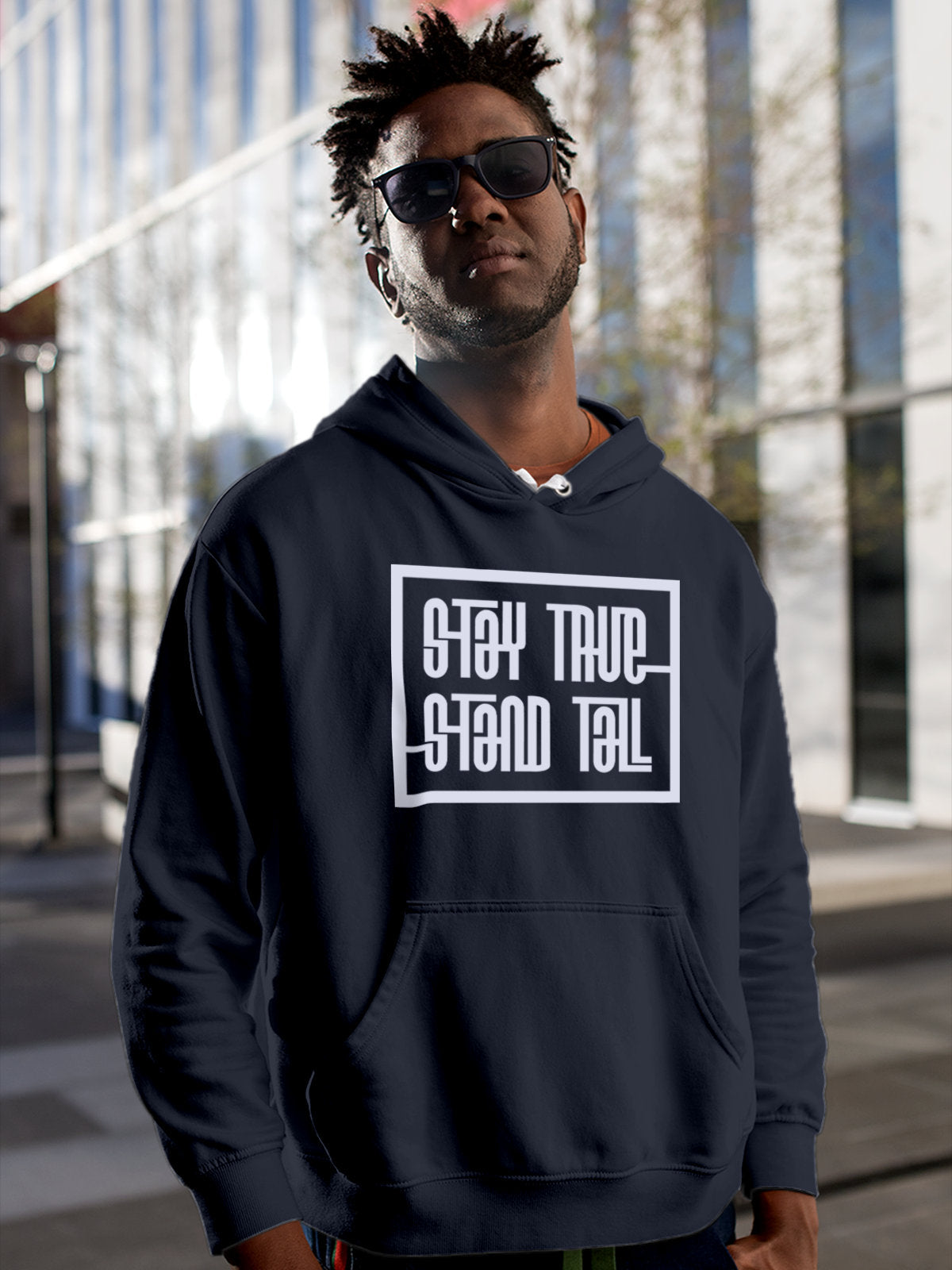 Model wearing Men's Navy Blue Hoodie Sweatshirt with 'Stay True Stand Tall' design, offering effortless style and premium comfort