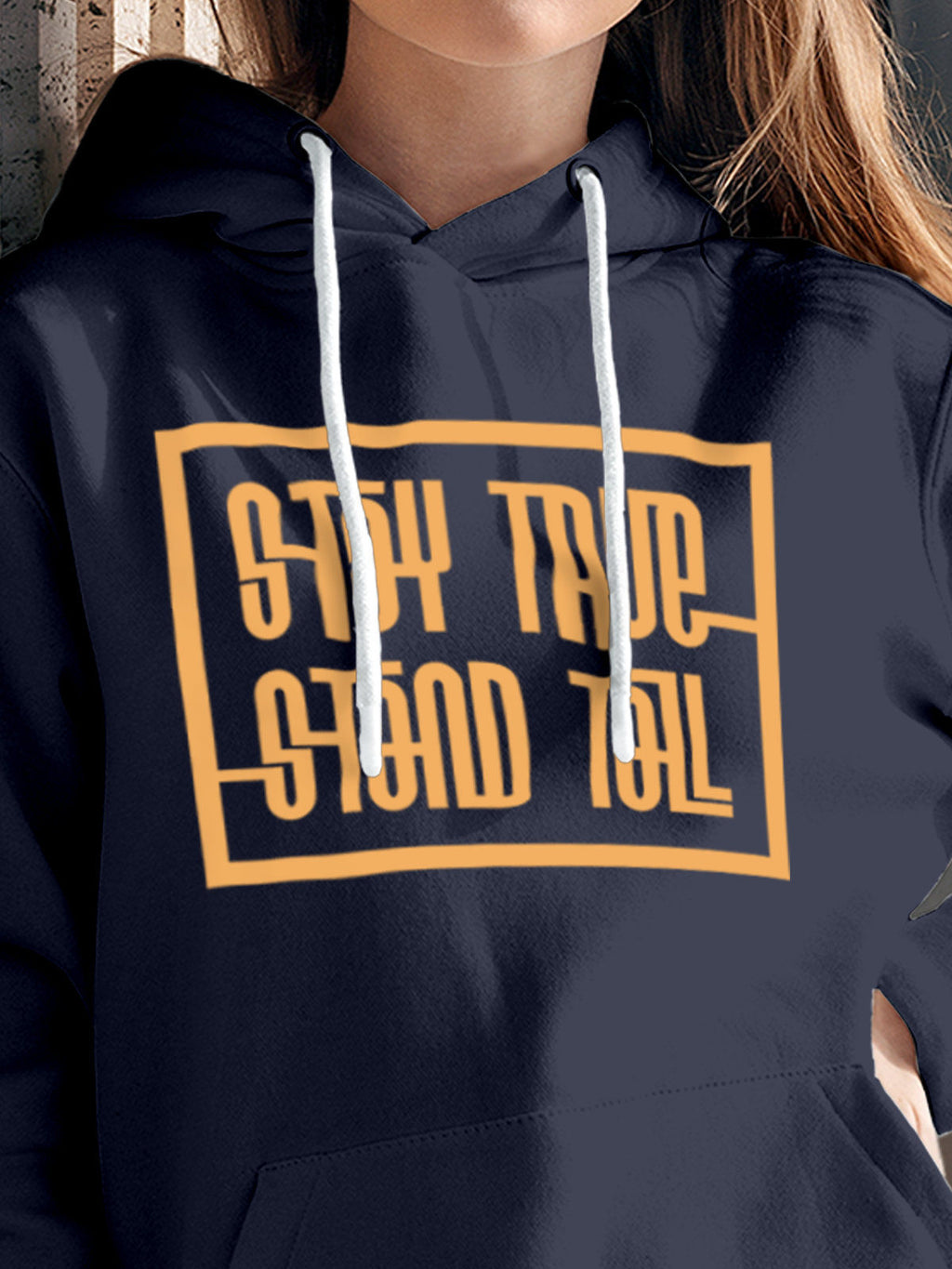 Close up of 'Stay True Stand Tall' design on Women's Navy Blue Hoodie Sweatshirt, highlighting intricate details and vibrant print.