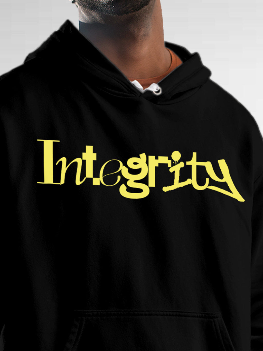 Close up of 'Integrity' design on Men's Black Hoodie Sweatshirt, highlighting intricate details and vibrant print.