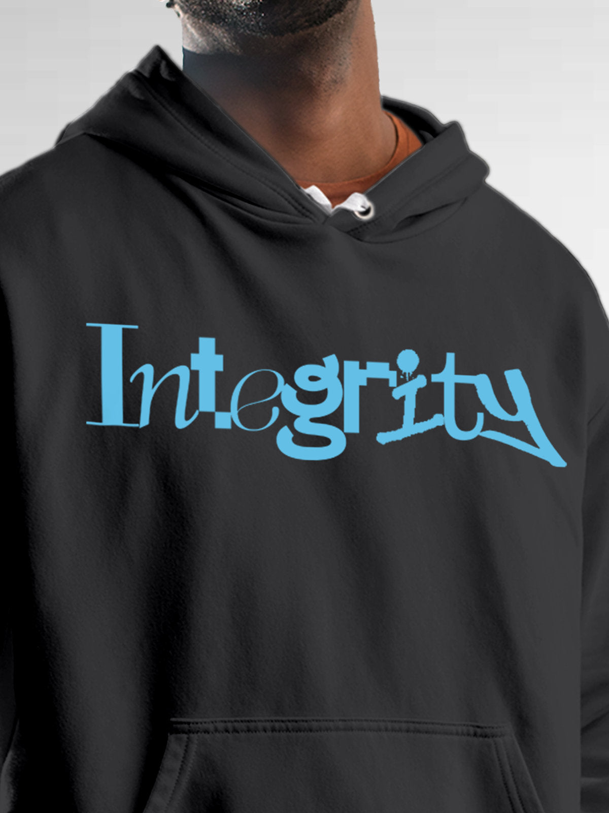 Close up of 'Integrity' design on Men's Dark Grey Hoodie Sweatshirt, highlighting intricate details and vibrant print.