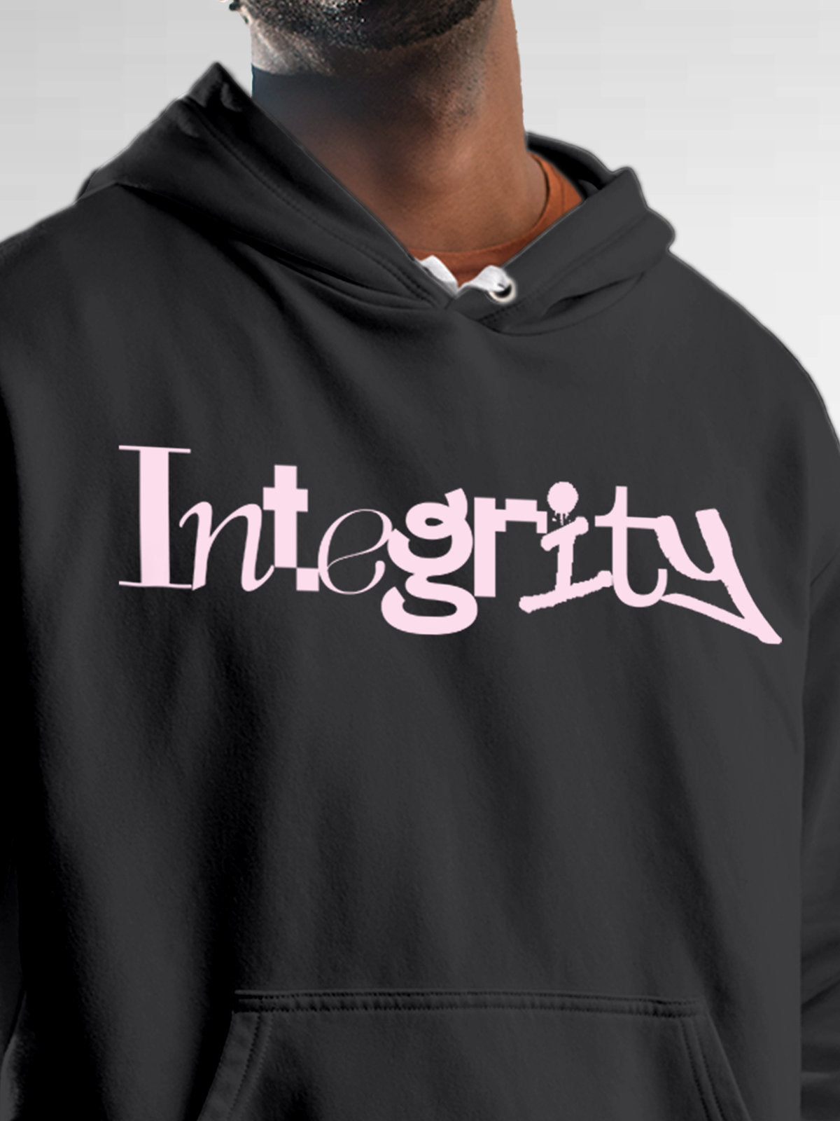 Close up of 'Integrity' design on Men's Dark Grey Hoodie Sweatshirt, highlighting intricate details and vibrant print.